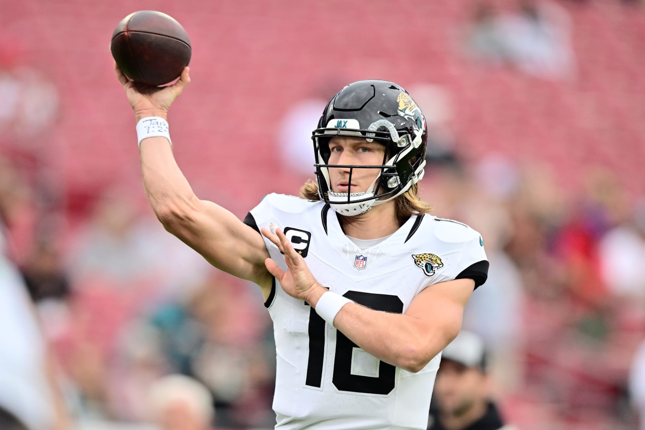 TAMPA, FLORIDA - DECEMBER 24:  Trevor Lawrence #16 of the Jacksonville Jaguars warms up prior to the game against the Tampa Bay Buccaneers at Raymond James Stadium on December 24, 2023 in Tampa, Florida. (Photo by Julio Aguilar/Getty Images)