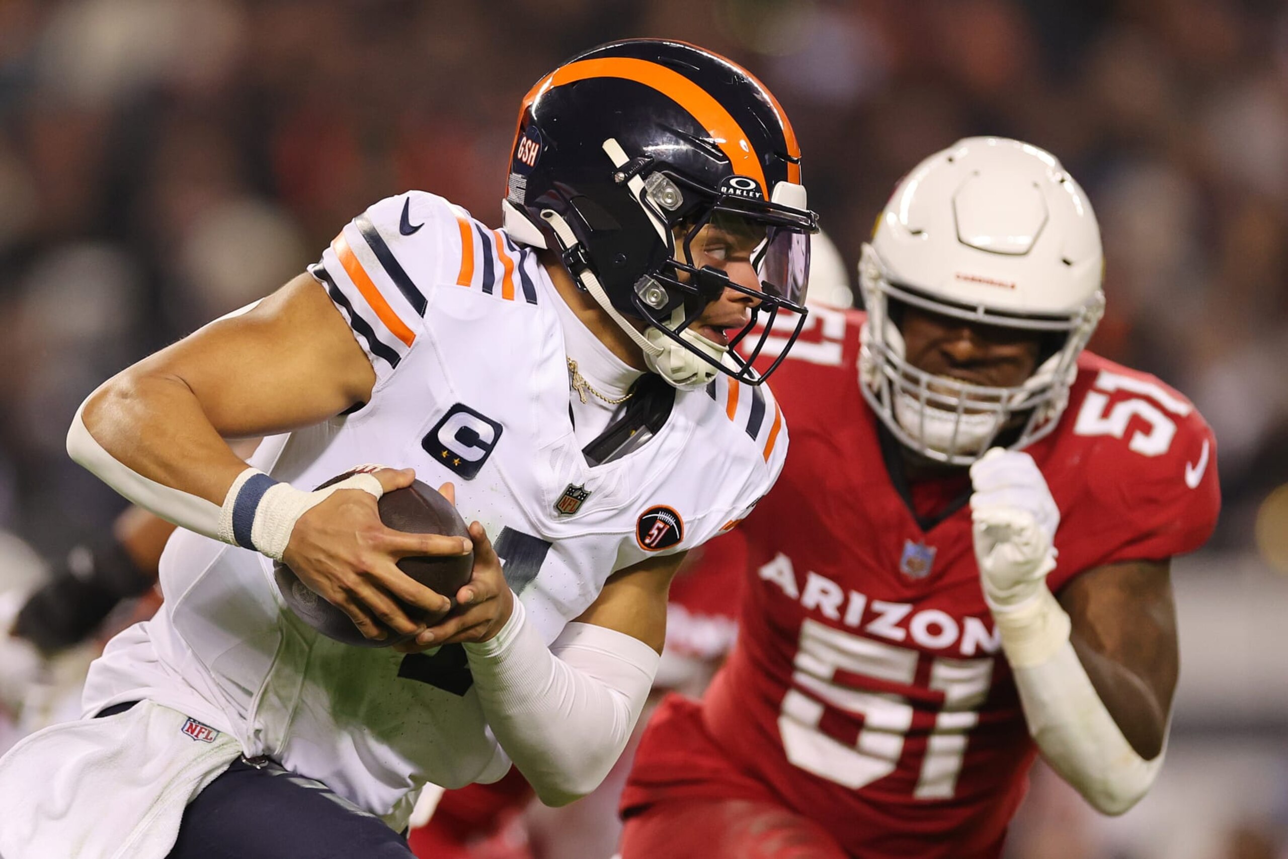 CHICAGO, ILLINOIS - DECEMBER 24: Justin Fields #1 of the Chicago Bears runs with the ball during the third quarter against the Arizona Cardinals at Soldier Field on December 24, 2023 in Chicago, Illinois. (Photo by Michael Reaves/Getty Images)