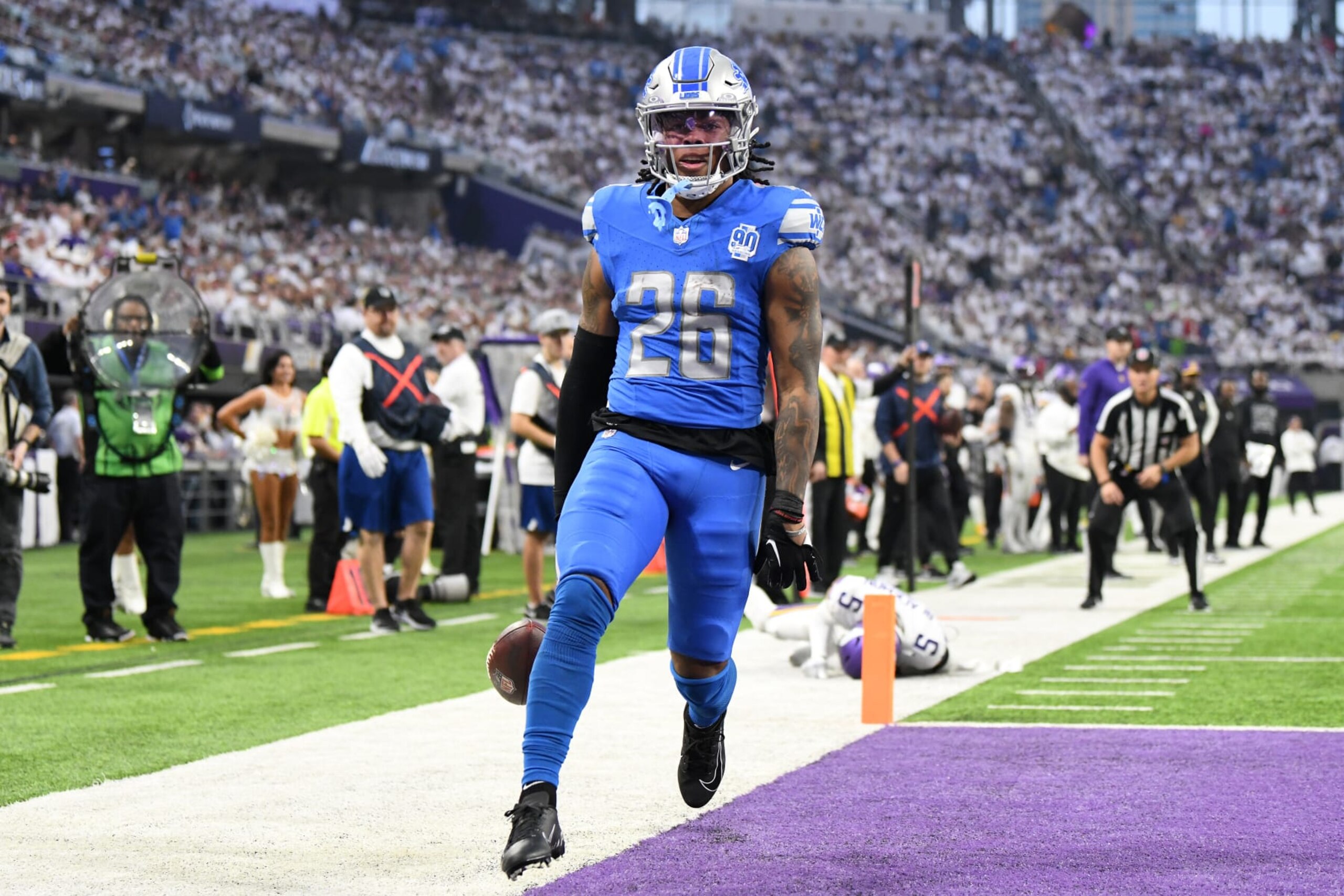 MINNEAPOLIS, MINNESOTA - DECEMBER 24:  Jahmyr Gibbs #26 of the Detroit Lions scores a rushing touchdown against the Minnesota Vikings during the second quarter at U.S. Bank Stadium on December 24, 2023 in Minneapolis, Minnesota. (Photo by Stephen Maturen/Getty Images)