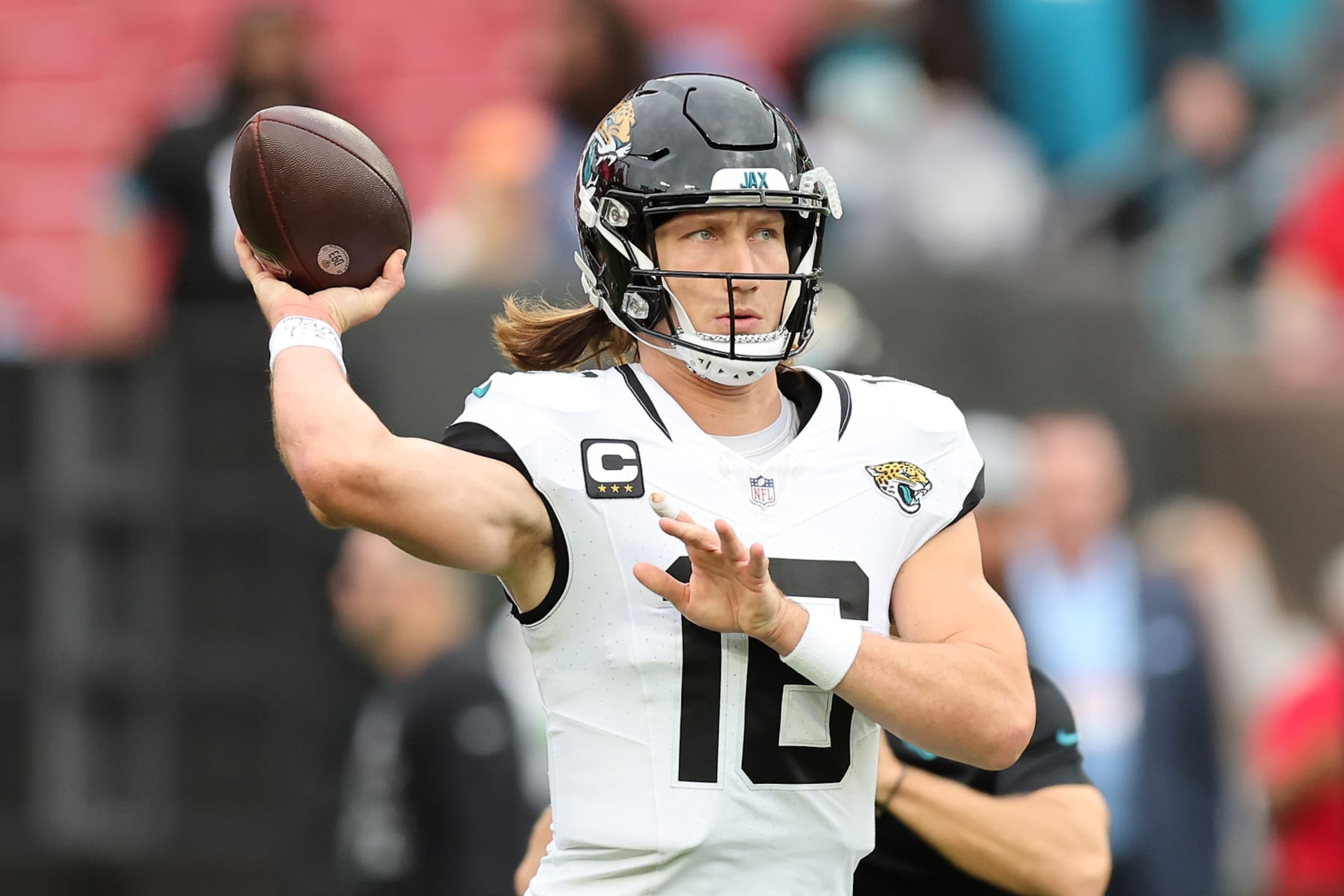TAMPA, FLORIDA - DECEMBER 24: Trevor Lawrence #16 of the Jacksonville Jaguars warms up prior to the game against the Tampa Bay Buccaneers at Raymond James Stadium on December 24, 2023 in Tampa, Florida. (Photo by Mike Carlson/Getty Images) TAMPA, FLORIDA - DECEMBER 24: Trevor Lawrence #16 of the Jacksonville Jaguars warms up prior to the game against the Tampa Bay Buccaneers at Raymond James Stadium on December 24, 2023 in Tampa, Florida. (Photo by Mike Carlson/Getty Images)