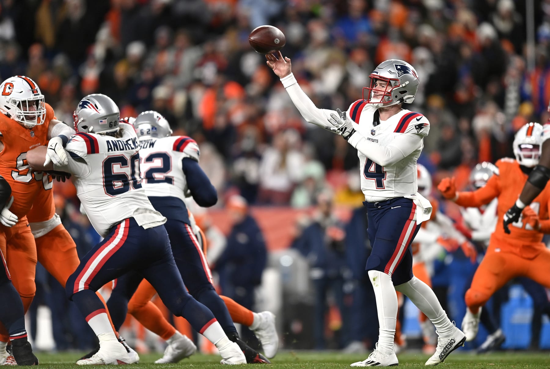 DENVER, COLORADO - DECEMBER 24:  Quarterback Bailey Zappe #4 of the New England Patriots passes during the 1st half of the game against the Denver Broncos at Empower Field At Mile High on December 24, 2023 in Denver, Colorado. (Photo by Dustin Bradford/Getty Images)