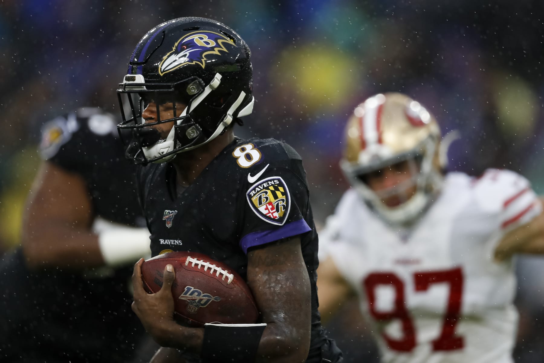 BALTIMORE, MD - DECEMBER 01: Lamar Jackson #8 of the Baltimore Ravens carries the ball during the first half of the game against the San Francisco 49ers at M&T Bank Stadium on December 1, 2019 in Baltimore, Maryland. (Photo by Scott Taetsch/Getty Images)