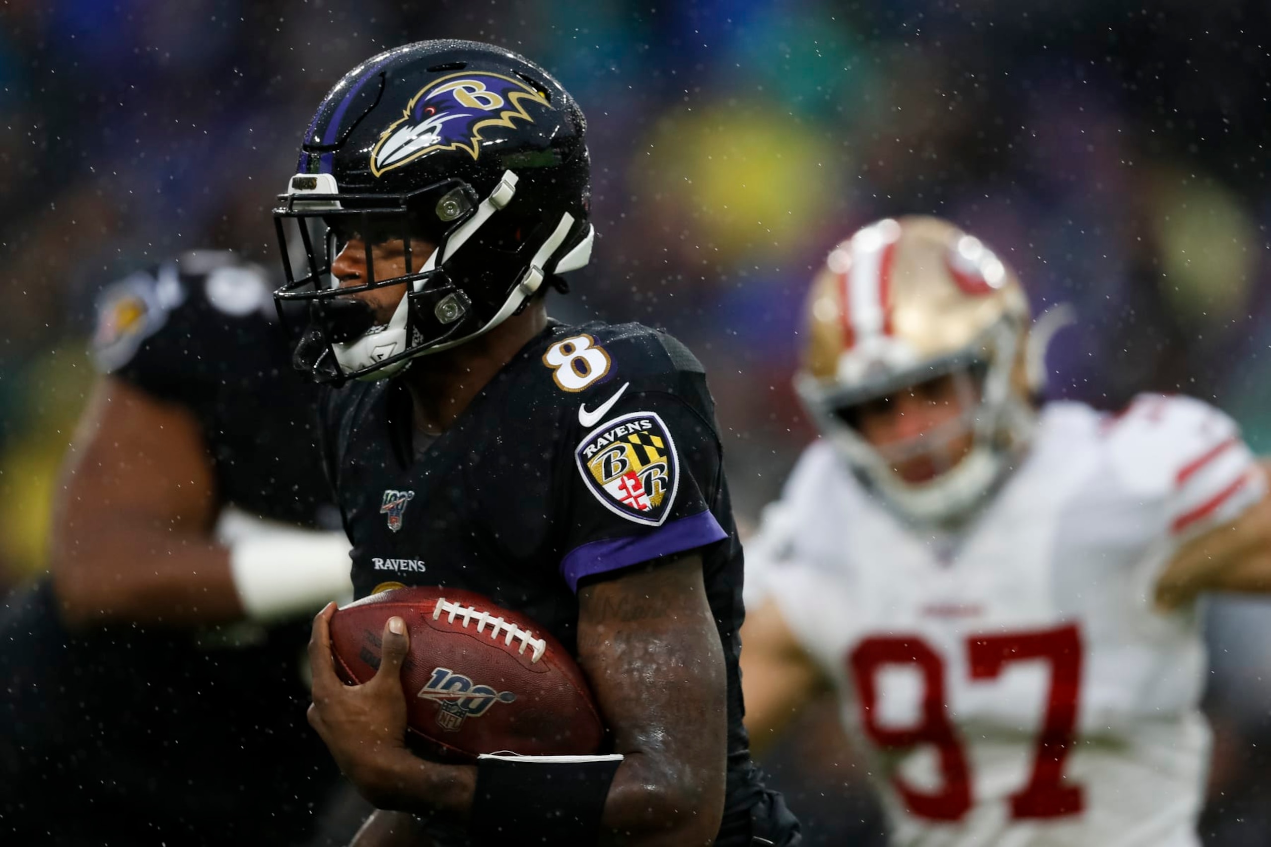 BALTIMORE, MD - DECEMBER 01: Lamar Jackson #8 of the Baltimore Ravens carries the ball during the first half of the game against the San Francisco 49ers at M&T Bank Stadium on December 1, 2019 in Baltimore, Maryland. (Photo by Scott Taetsch/Getty Images)