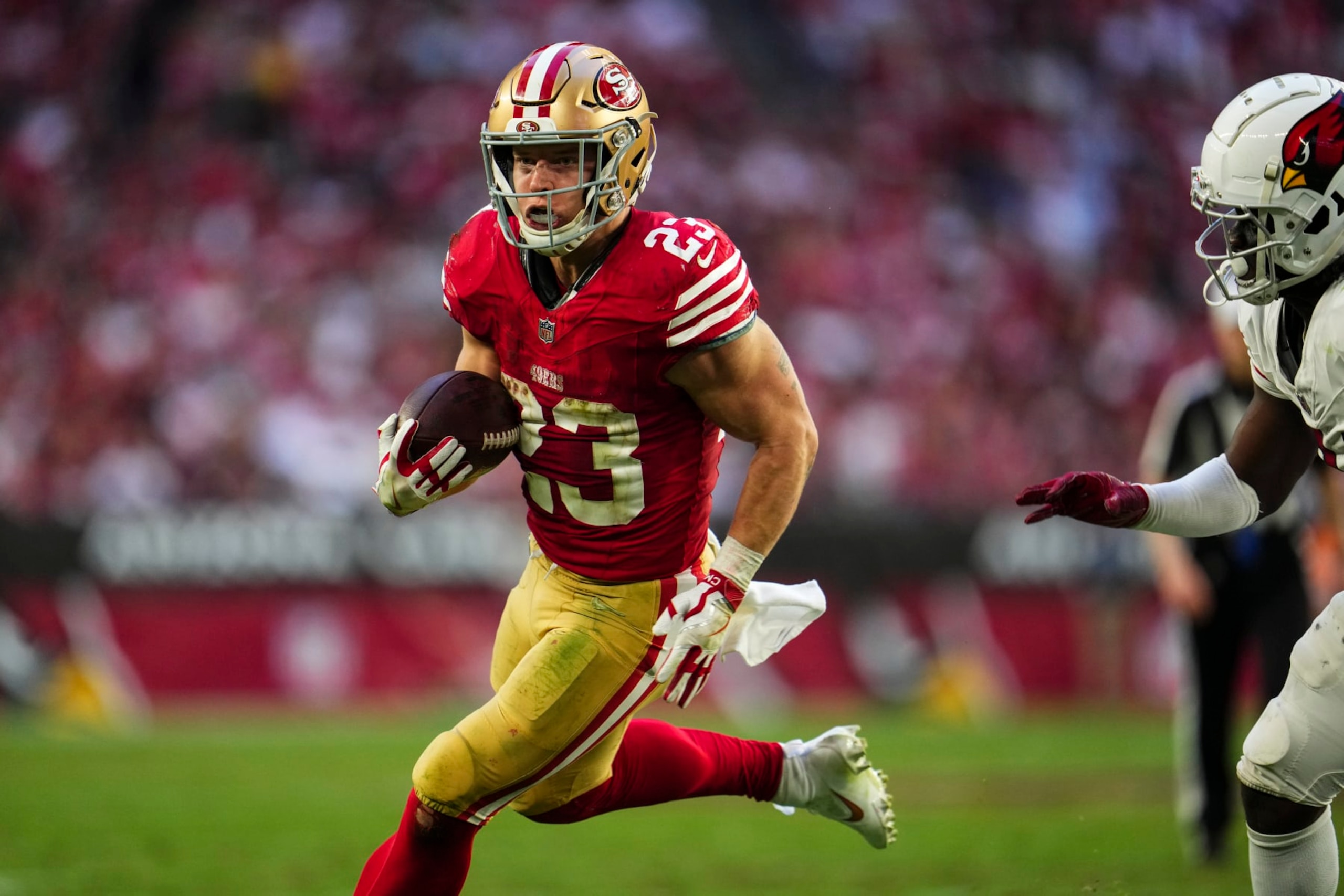 GLENDALE, AZ - DECEMBER 17: Christian McCaffrey #23 of the San Francisco 49ers runs the ball during an NFL football game against the Arizona Cardinals at State Farm Stadium on December 17, 2023 in Glendale, Arizona. (Photo by Cooper Neill/Getty Images) GLENDALE, AZ - DECEMBER 17: Christian McCaffrey #23 of the San Francisco 49ers runs the ball during an NFL football game against the Arizona Cardinals at State Farm Stadium on December 17, 2023 in Glendale, Arizona. (Photo by Cooper Neill/Getty Images)