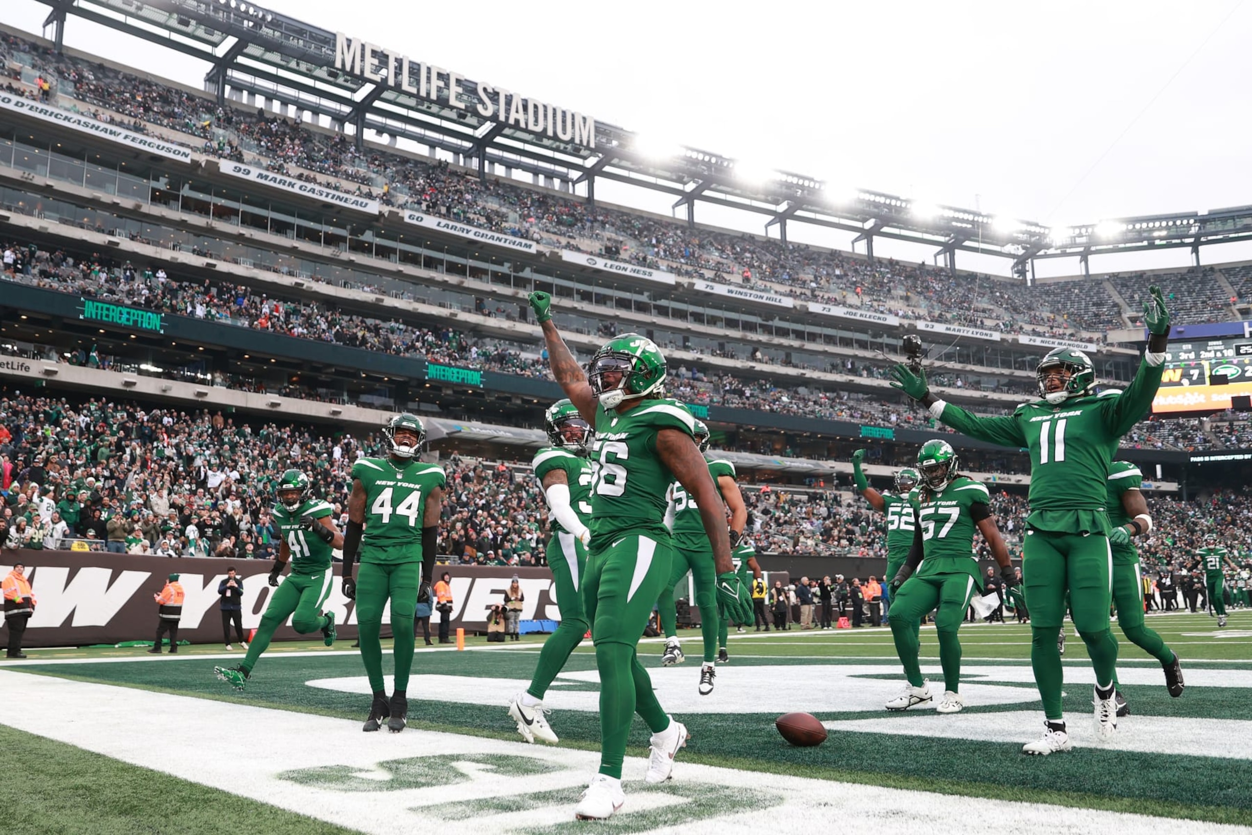 EAST RUTHERFORD, NEW JERSEY - DECEMBER 24: Quincy Williams #56 of the New York Jets celebrates an interception with teammates during the third quarter against the Washington Commanders at MetLife Stadium on December 24, 2023 in East Rutherford, New Jersey. (Photo by Dustin Satloff/Getty Images)