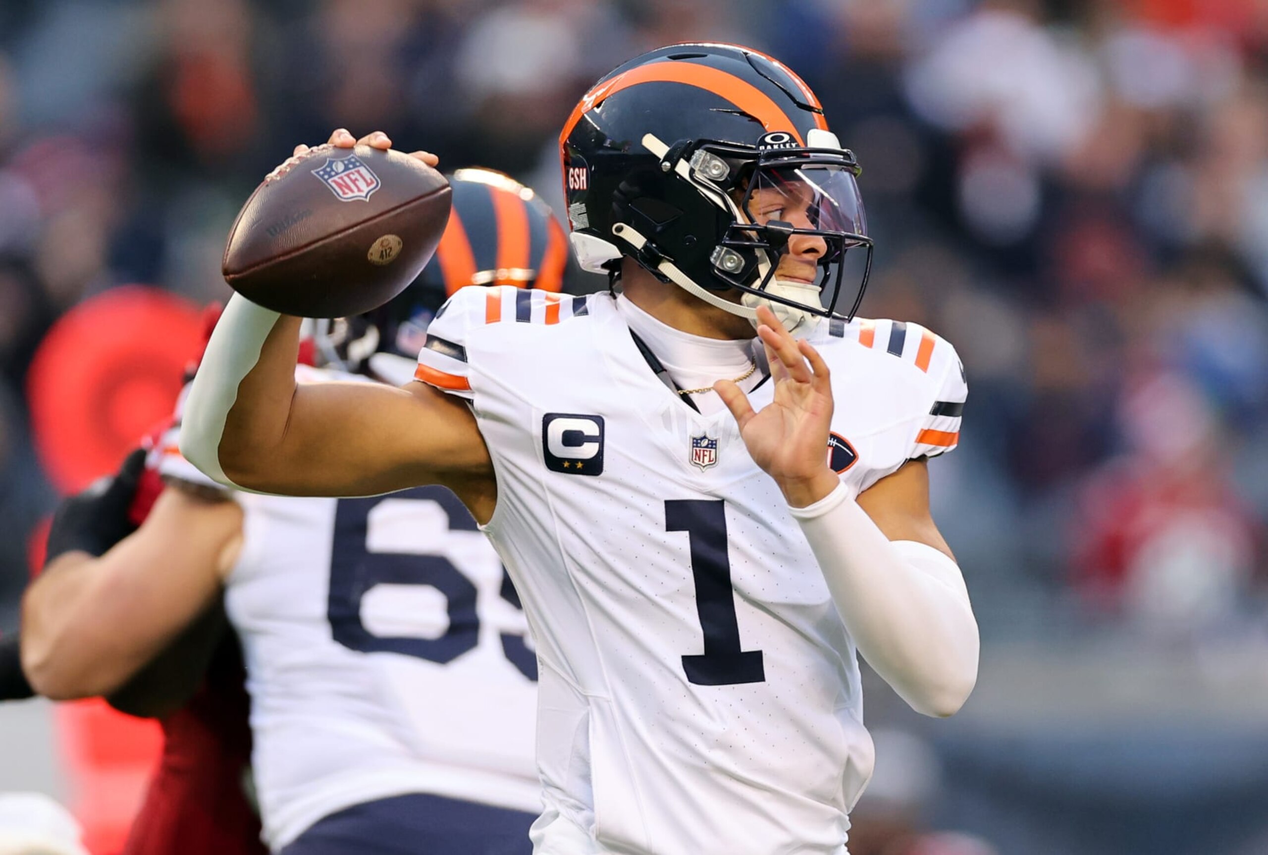 CHICAGO, ILLINOIS - DECEMBER 24: Justin Fields #1 of the Chicago Bears throws a pass during the first quarter against the Arizona Cardinals at Soldier Field on December 24, 2023 in Chicago, Illinois. (Photo by Michael Reaves/Getty Images) CHICAGO, ILLINOIS - DECEMBER 24: Justin Fields #1 of the Chicago Bears throws a pass during the first quarter against the Arizona Cardinals at Soldier Field on December 24, 2023 in Chicago, Illinois. (Photo by Michael Reaves/Getty Images)