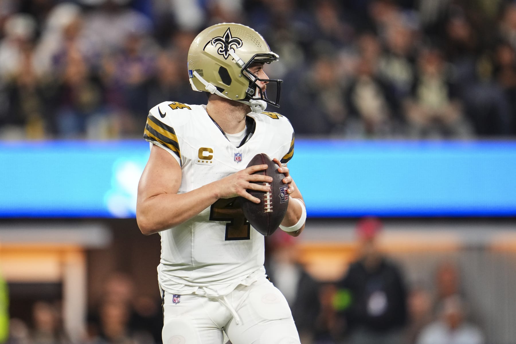 INGLEWOOD, CA - DECEMBER 21: Derek Carr #4 of the New Orleans Saints drops back to pass during an NFL football game against the Los Angeles Rams at SoFi Stadium on December 21, 2023 in Inglewood, California. (Photo by Cooper Neill/Getty Images)