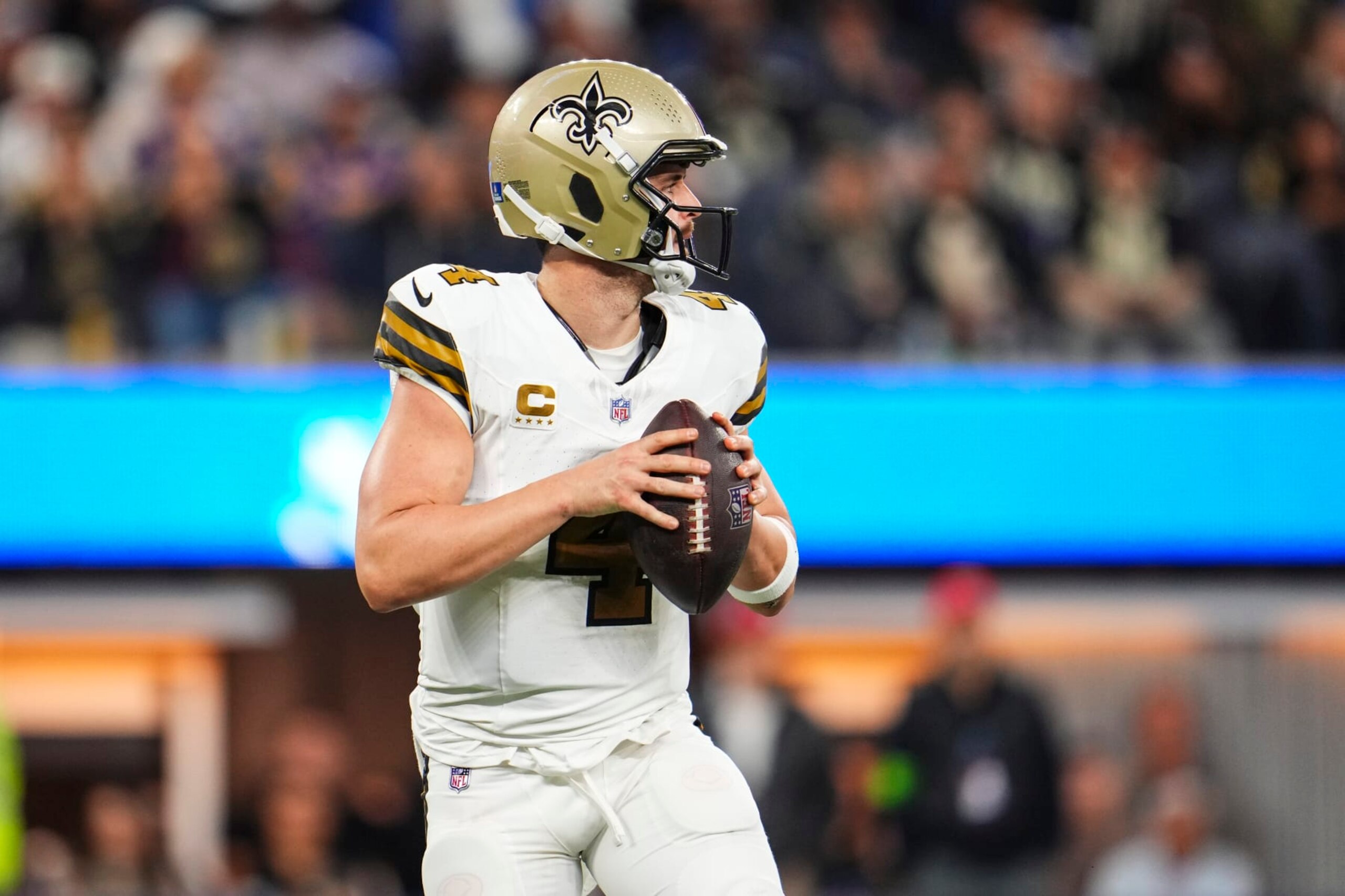 INGLEWOOD, CA - DECEMBER 21: Derek Carr #4 of the New Orleans Saints drops back to pass during an NFL football game against the Los Angeles Rams at SoFi Stadium on December 21, 2023 in Inglewood, California. (Photo by Cooper Neill/Getty Images)