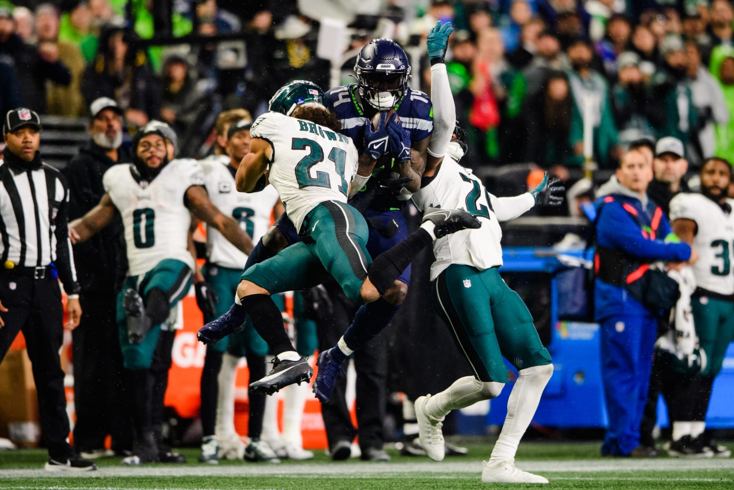 SEATTLE, WASHINGTON - DECEMBER 18: Seattle Seahawks wide receiver DK Metcalf #14 catches the ball during the fourth quarter of the game against the Philadelphia Eagles at Lumen Field on December 18, 2023 in Seattle, Washington. (Photo by Jane Gershovich/Getty Images)