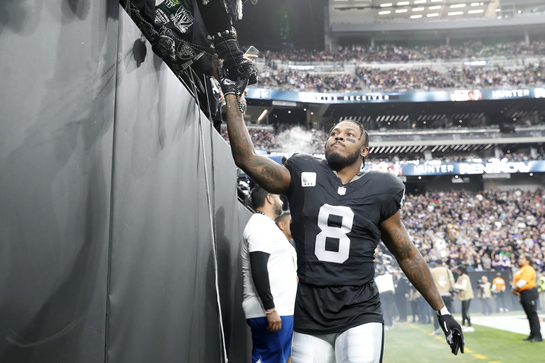 LAS VEGAS, NEVADA - DECEMBER 10: Josh Jacobs #8 of the Las Vegas Raiders greets fans before the game against the Minnesota Vikings at Allegiant Stadium on December 10, 2023 in Las Vegas, Nevada. (Photo by Steve Marcus/Getty Images)