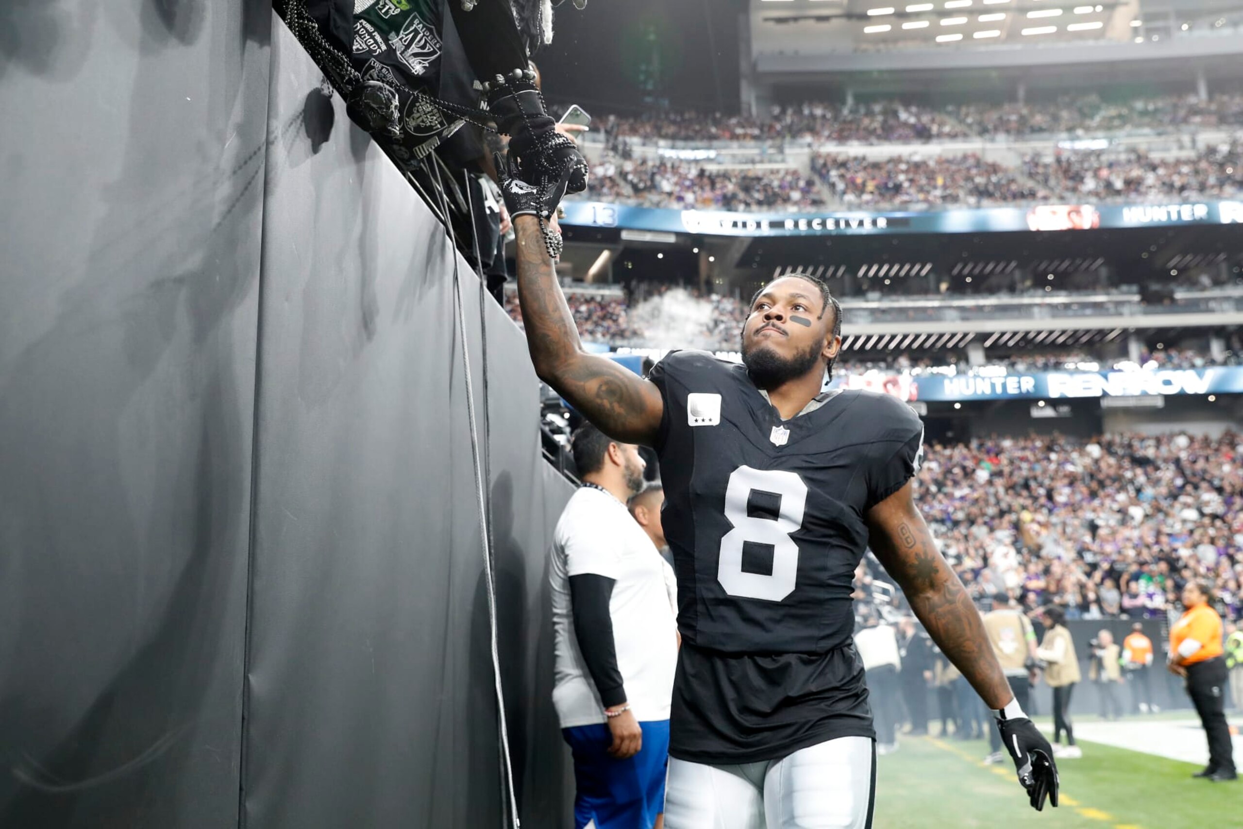 LAS VEGAS, NEVADA - DECEMBER 10: Josh Jacobs #8 of the Las Vegas Raiders greets fans before the game against the Minnesota Vikings at Allegiant Stadium on December 10, 2023 in Las Vegas, Nevada. (Photo by Steve Marcus/Getty Images) LAS VEGAS, NEVADA - DECEMBER 10: Josh Jacobs #8 of the Las Vegas Raiders greets fans before the game against the Minnesota Vikings at Allegiant Stadium on December 10, 2023 in Las Vegas, Nevada. (Photo by Steve Marcus/Getty Images)