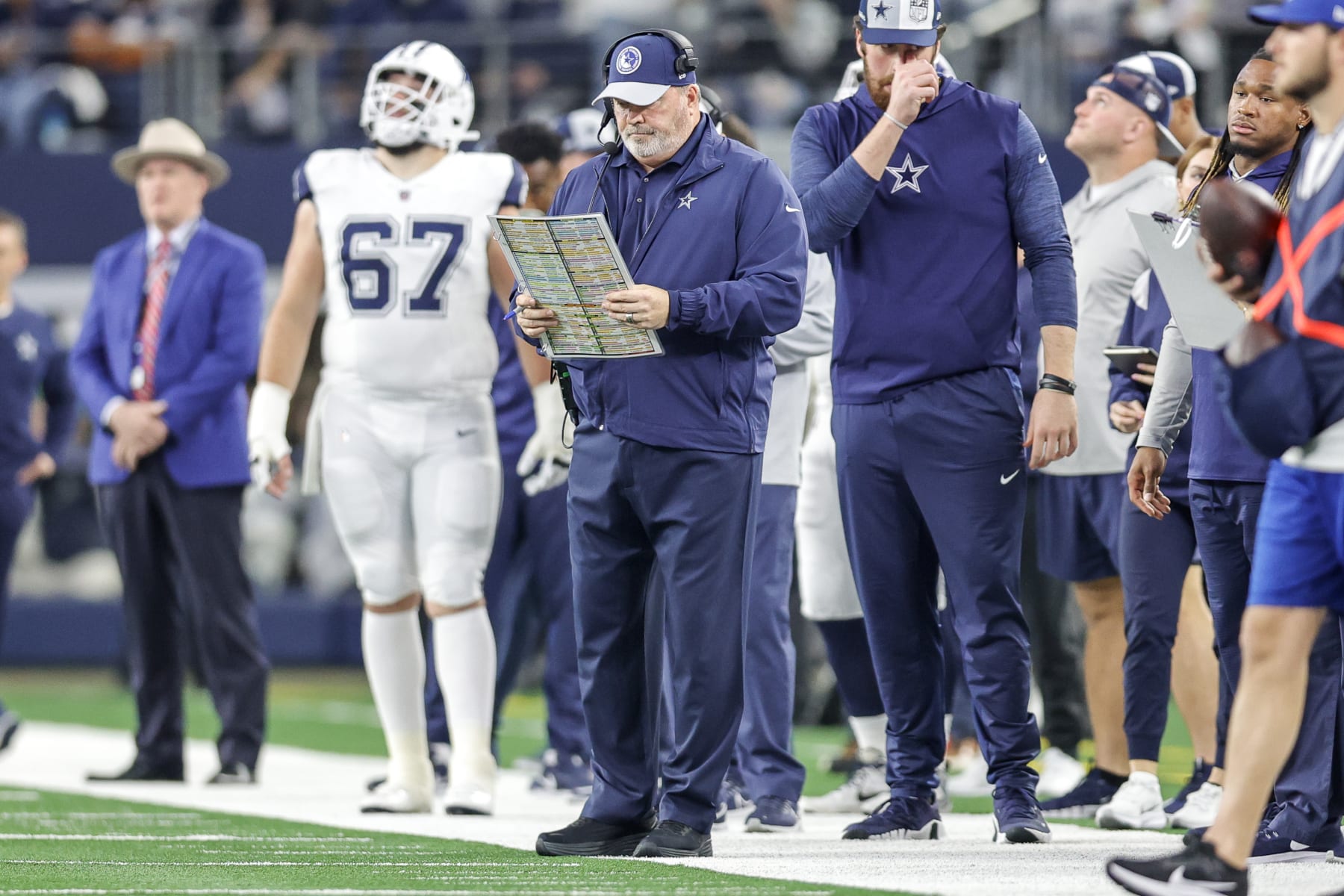ARLINGTON, TX - DECEMBER 10: Dallas Cowboys Head Coach Mike McCarthy looks over his play sheet during the game between the Dallas Cowboys and the Philadelphia Eagles on December 10, 2023 at AT&T Stadium in Arlington, Texas. (Photo by Matthew Pearce/Icon Sportswire via Getty Images)