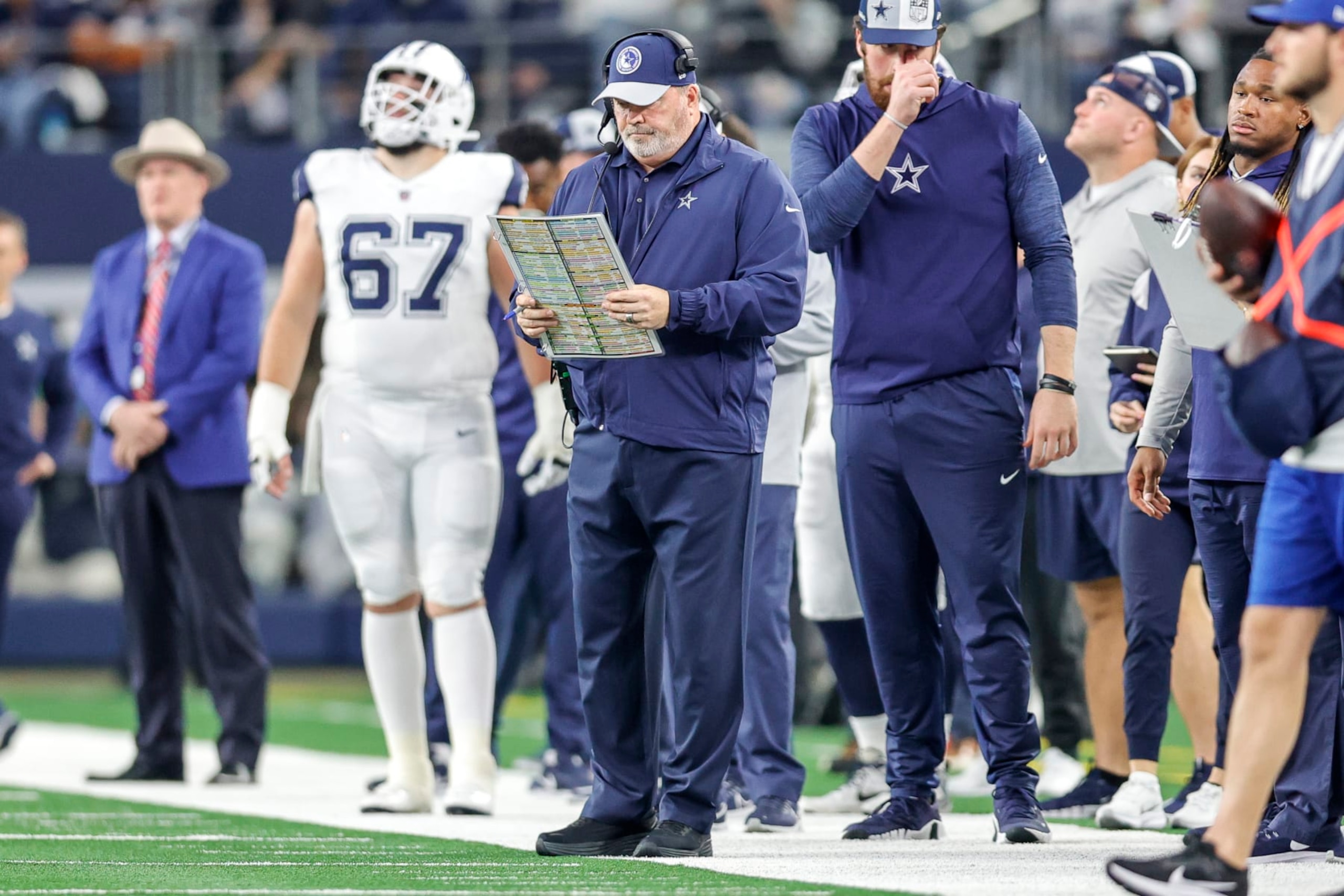 ARLINGTON, TX - DECEMBER 10: Dallas Cowboys Head Coach Mike McCarthy looks over his play sheet during the game between the Dallas Cowboys and the Philadelphia Eagles on December 10, 2023 at AT&T Stadium in Arlington, Texas. (Photo by Matthew Pearce/Icon Sportswire via Getty Images)