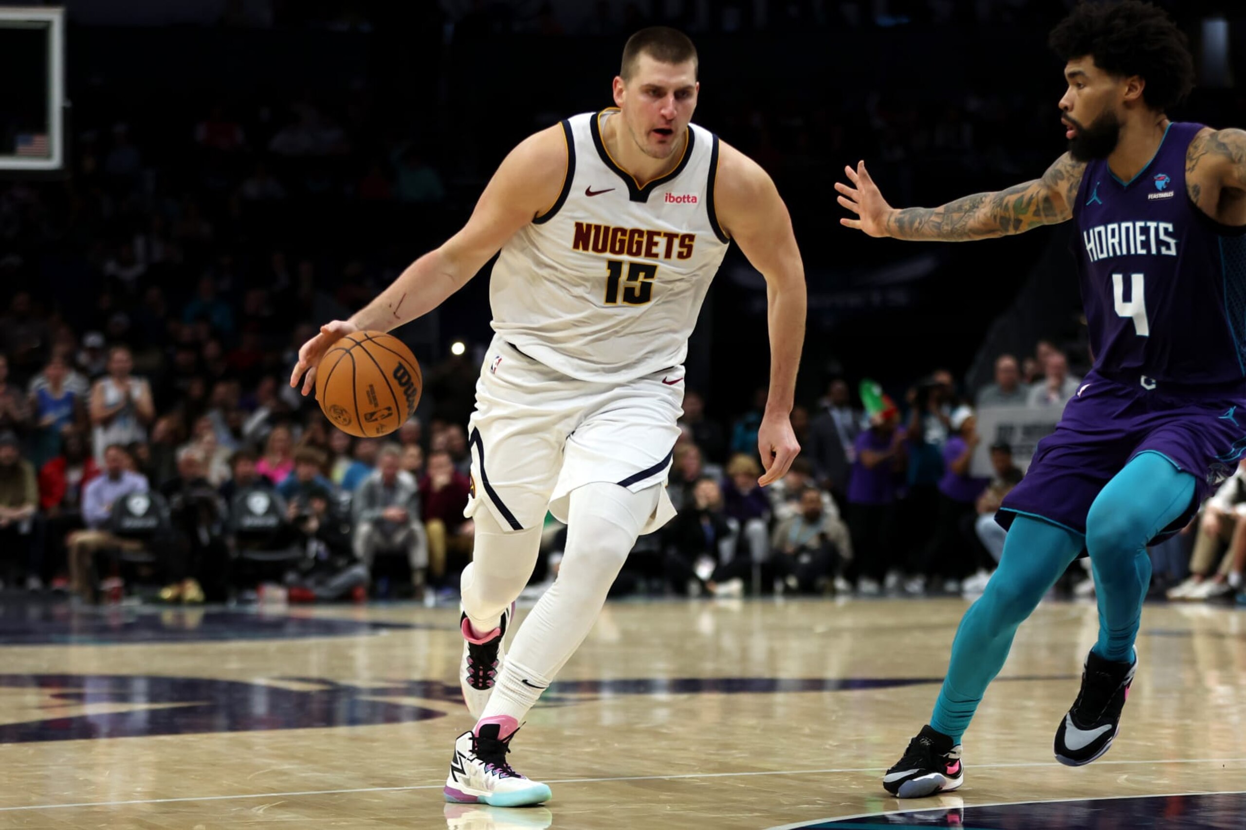 CHARLOTTE, NORTH CAROLINA - DECEMBER 23: Nikola Jokic #15 of the Denver Nuggets drives to the basket during the second half of an NBA game against the Charlotte Hornets at Spectrum Center on December 23, 2023 in Charlotte, North Carolina. NOTE TO USER: User expressly acknowledges and agrees that, by downloading and or using this photograph, User is consenting to the terms and conditions of the Getty Images License Agreement. (Photo by David Jensen/Getty Images)