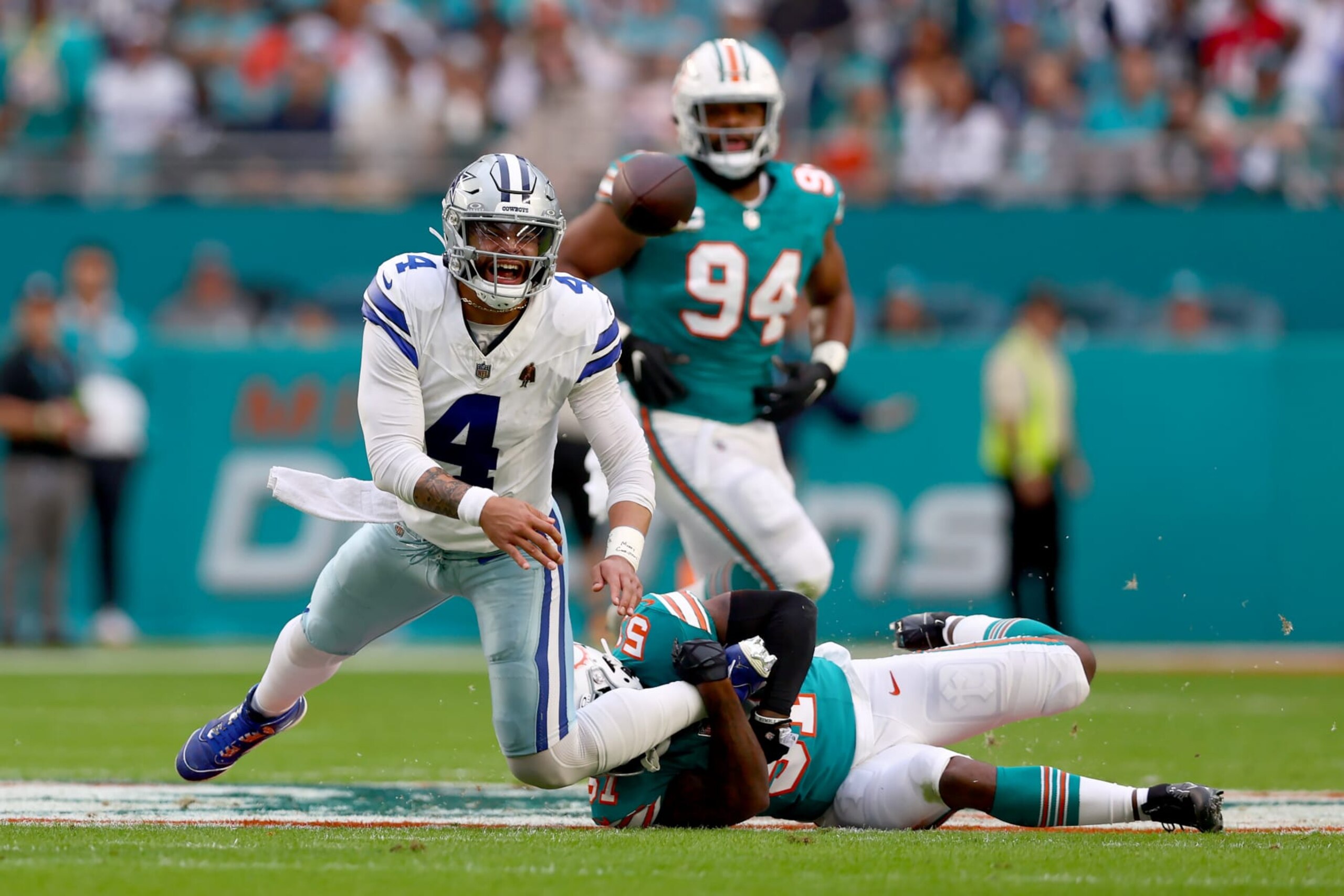 MIAMI GARDENS, FLORIDA - DECEMBER 24: Dak Prescott #4 of the Dallas Cowboys is tackled by David Long Jr. #51 of the Miami Dolphins during the first half at Hard Rock Stadium on December 24, 2023 in Miami Gardens, Florida. (Photo by Megan Briggs/Getty Images) MIAMI GARDENS, FLORIDA - DECEMBER 24: Dak Prescott #4 of the Dallas Cowboys is tackled by David Long Jr. #51 of the Miami Dolphins during the first half at Hard Rock Stadium on December 24, 2023 in Miami Gardens, Florida. (Photo by Megan Briggs/Getty Images)