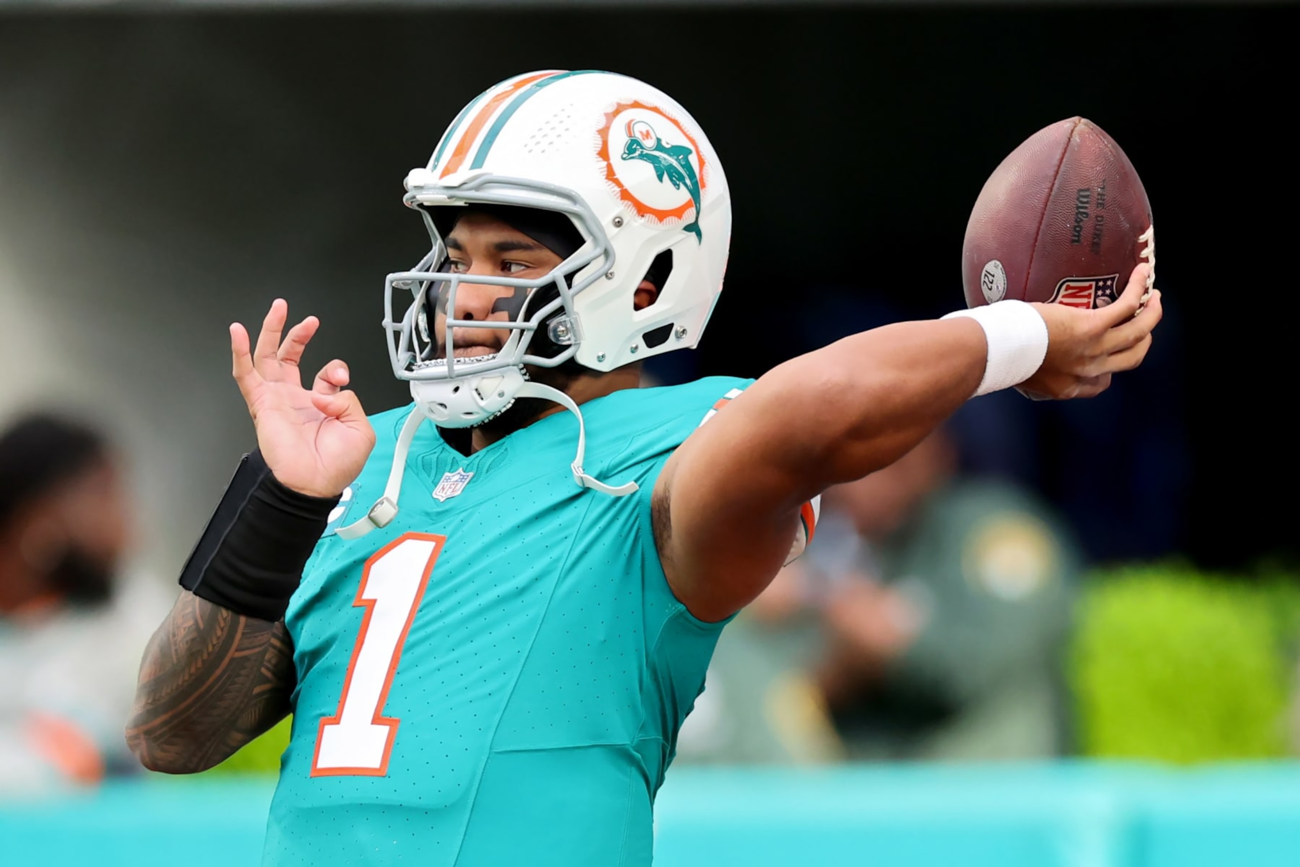 MIAMI GARDENS, FLORIDA - DECEMBER 24: Tua Tagovailoa #1 of the Miami Dolphins warms up prior to the game against the Dallas Cowboys at Hard Rock Stadium on December 24, 2023 in Miami Gardens, Florida. (Photo by Stacy Revere/Getty Images)