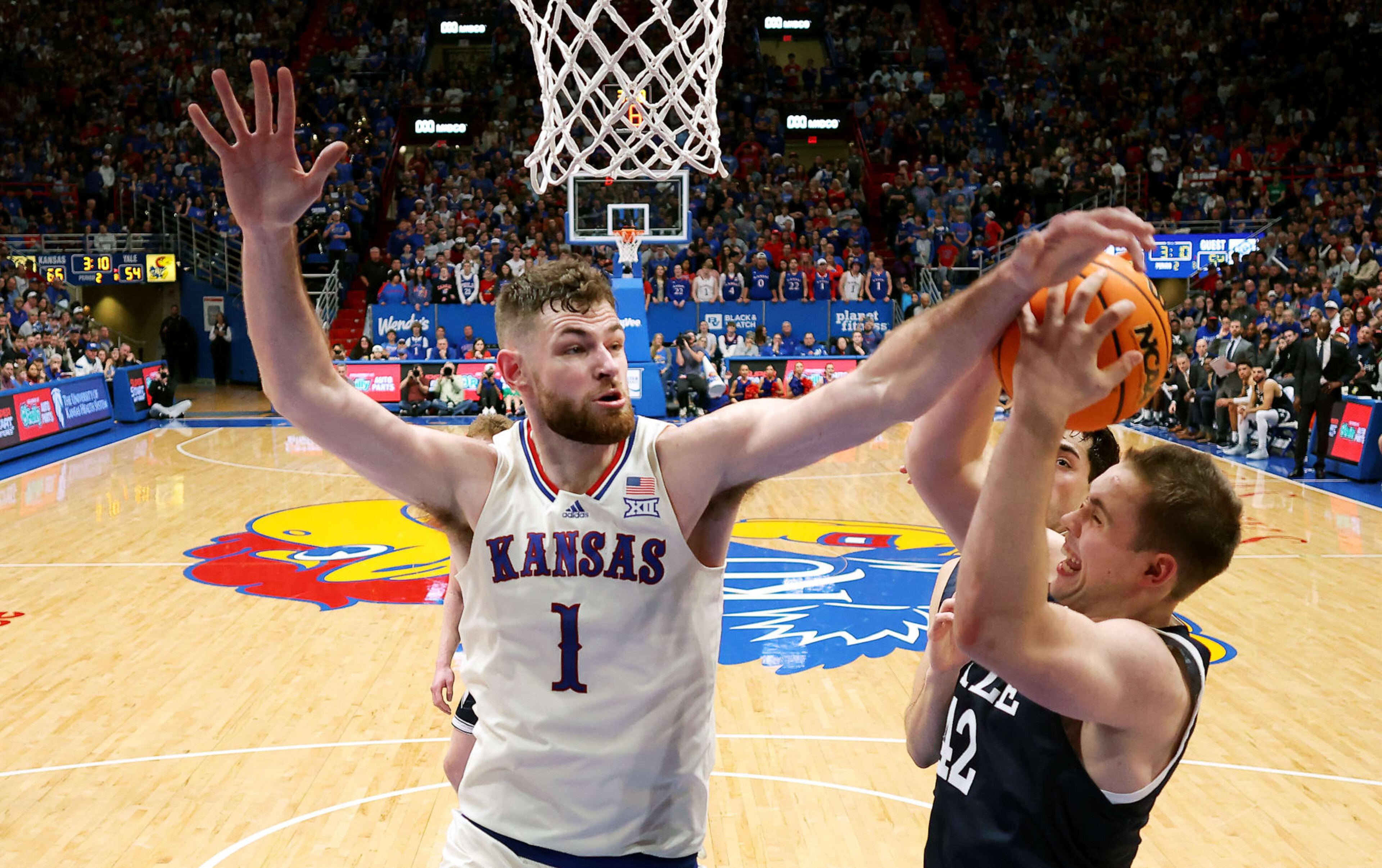 LAWRENCE, KANSAS - DECEMBER 22:  Hunter Dickinson #1 of the Kansas Jayhawks blocks a shot by Nick Townsend #42 of the Yale Bulldogs during the game at Allen Fieldhouse on December 22, 2023 in Lawrence, Kansas. (Photo by Jamie Squire/Getty Images)