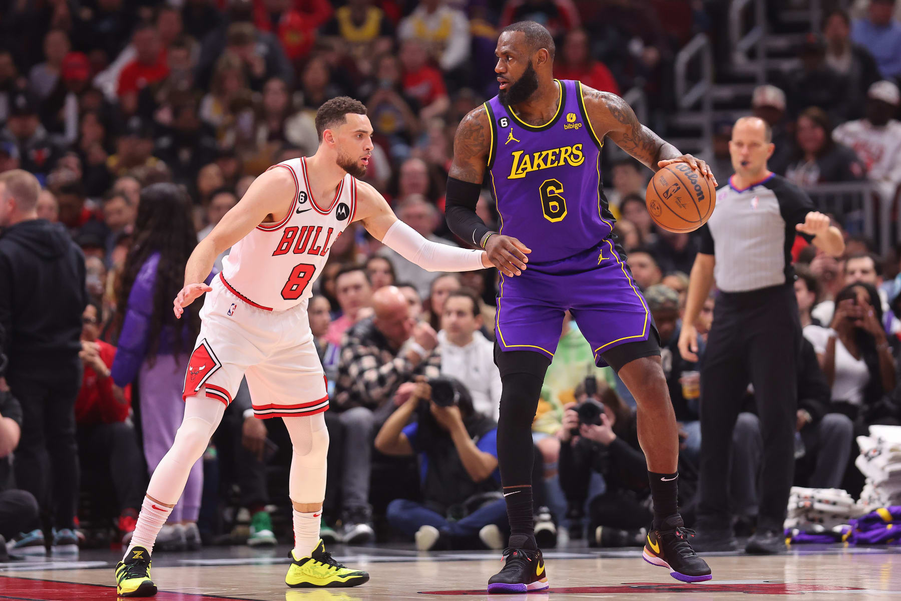 CHICAGO, ILLINOIS - MARCH 29: LeBron James #6 of the Los Angeles Lakers is defended by Zach LaVine #8 of the Chicago Bulls during the first half at United Center on March 29, 2023 in Chicago, Illinois. NOTE TO USER: User expressly acknowledges and agrees that, by downloading and or using this photograph, User is consenting to the terms and conditions of the Getty Images License Agreement. (Photo by Michael Reaves/Getty Images)