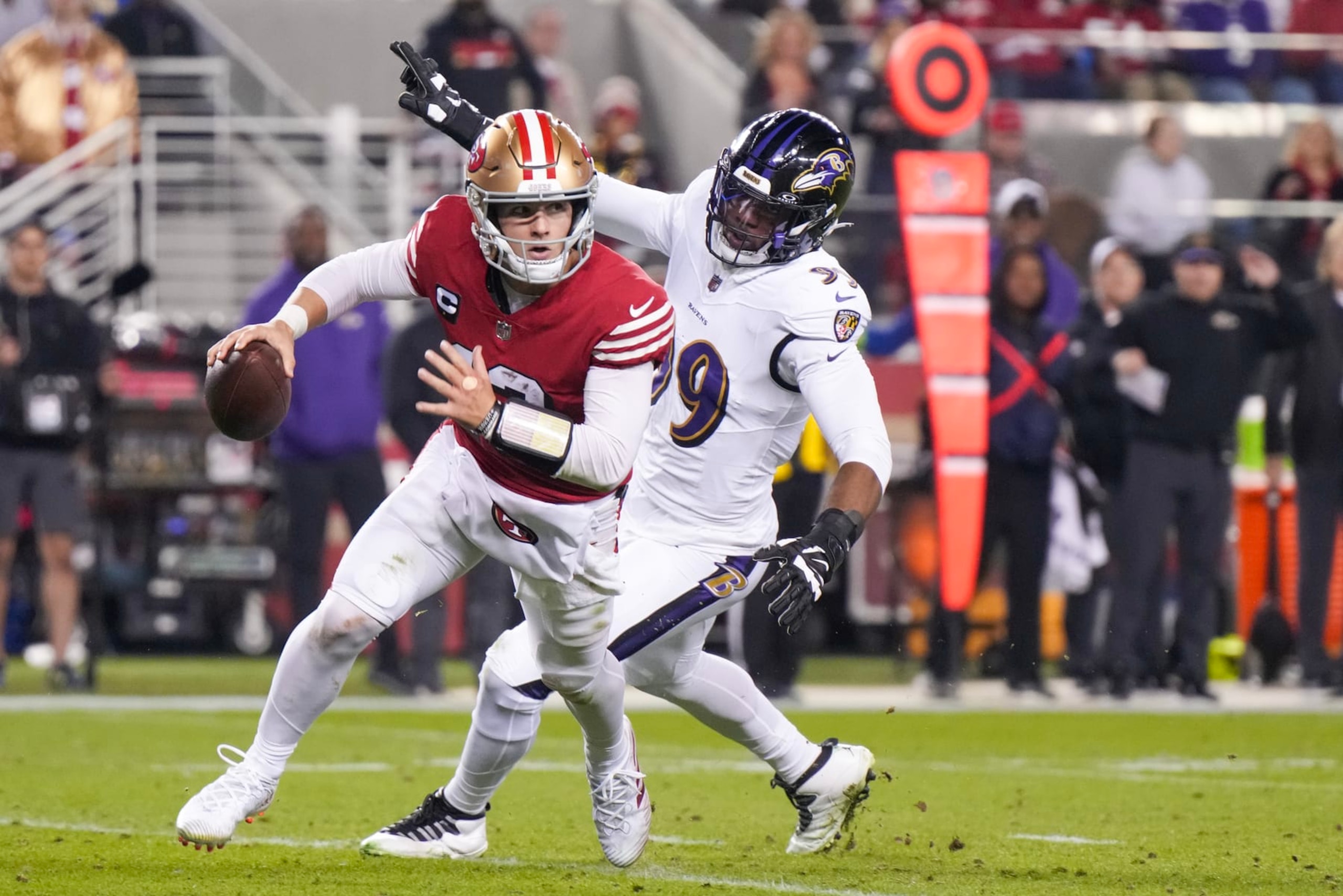 SANTA CLARA, CALIFORNIA - DECEMBER 25: Brock Purdy #13 of the San Francisco 49ers attempts a pass while pressured by Odafe Oweh #99 of the Baltimore Ravens during the second quarter at Levi's Stadium on December 25, 2023 in Santa Clara, California. (Photo by Loren Elliott/Getty Images) SANTA CLARA, CALIFORNIA - DECEMBER 25: Brock Purdy #13 of the San Francisco 49ers attempts a pass while pressured by Odafe Oweh #99 of the Baltimore Ravens during the second quarter at Levi's Stadium on December 25, 2023 in Santa Clara, California. (Photo by Loren Elliott/Getty Images)