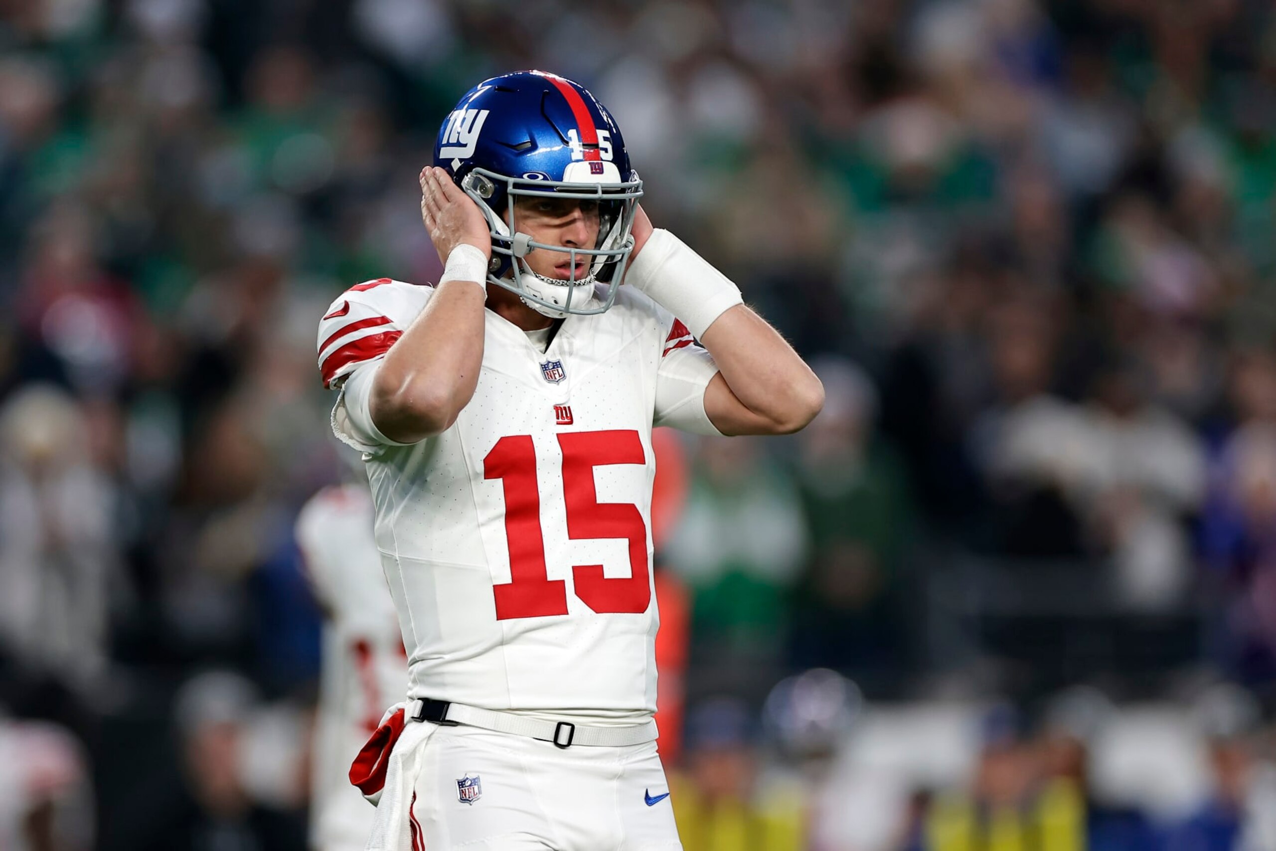 PHILADELPHIA, PENNSYLVANIA - DECEMBER 25: Tommy DeVito #15 of the New York Giants listens to a play call during the first quarter against the Philadelphia Eagles at Lincoln Financial Field on December 25, 2023 in Philadelphia, Pennsylvania. (Photo by Adam Hunger/Getty Images)