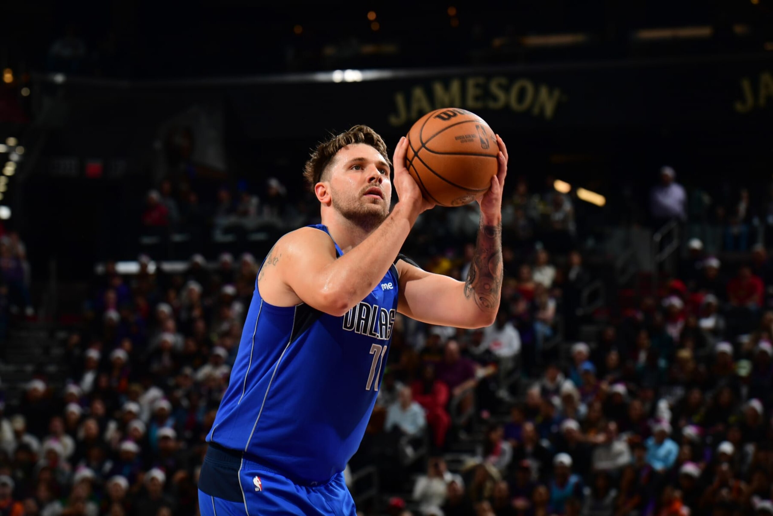 PHOENIX, AZ - DECEMBER 25: Luka Doncic #77 of the Dallas Mavericks shoots a free throw during the game against the Phoenix Suns on December 25, 2023 at Footprint Center in Phoenix, Arizona. NOTE TO USER: User expressly acknowledges and agrees that, by downloading and or using this photograph, user is consenting to the terms and conditions of the Getty Images License Agreement. Mandatory Copyright Notice: Copyright 2023 NBAE (Photo by Kate Frese/NBAE via Getty Images) PHOENIX, AZ - DECEMBER 25: Luka Doncic #77 of the Dallas Mavericks shoots a free throw during the game against the Phoenix Suns on December 25, 2023 at Footprint Center in Phoenix, Arizona. NOTE TO USER: User expressly acknowledges and agrees that, by downloading and or using this photograph, user is consenting to the terms and conditions of the Getty Images License Agreement. Mandatory Copyright Notice: Copyright 2023 NBAE (Photo by Kate Frese/NBAE via Getty Images)