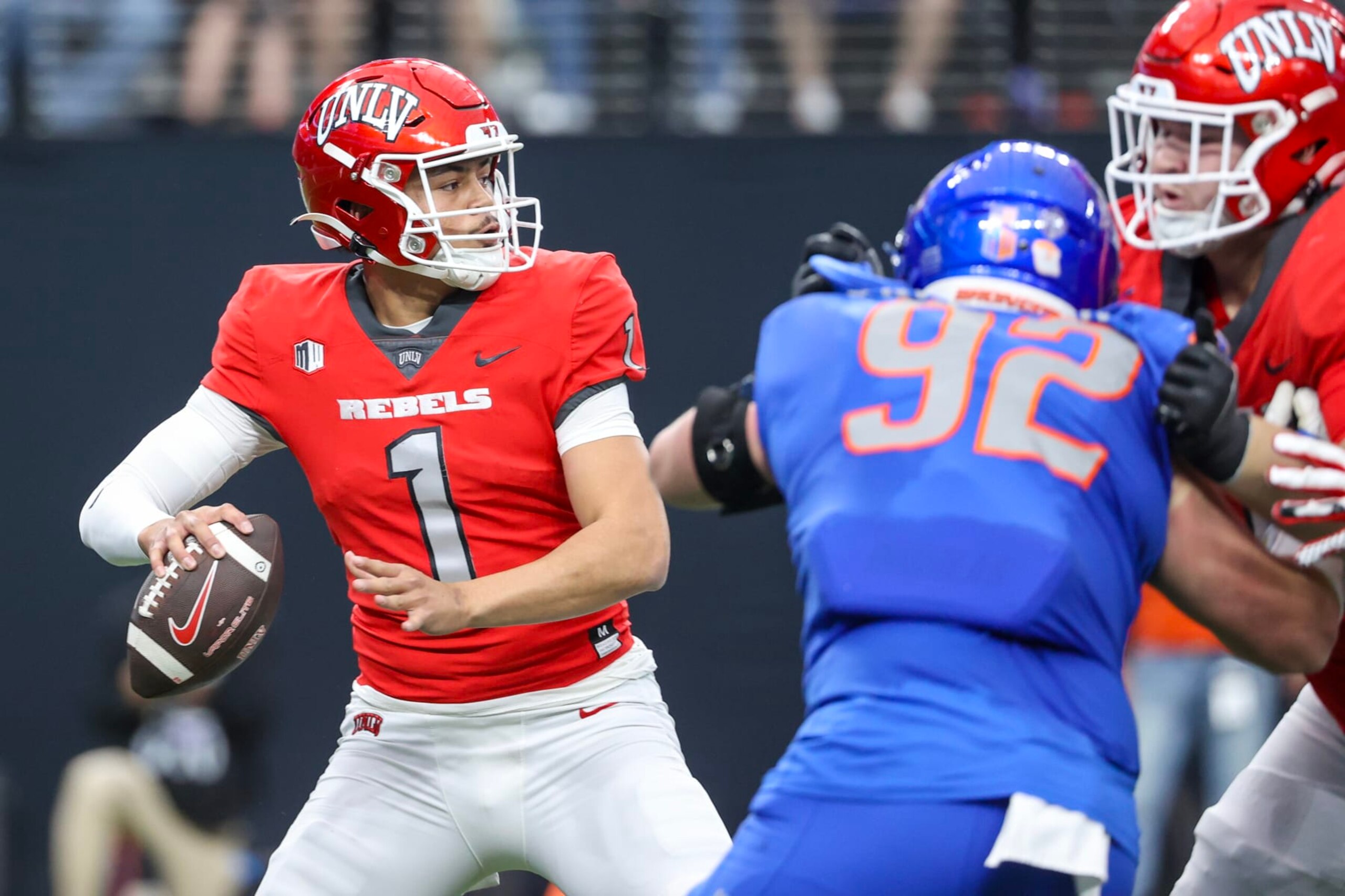 LAS VEGAS, NEVADA - DECEMBER 02: Jayden Maiava #1 of the UNLV Rebels attempts a pass during the first quarter against the Boise State Broncos during the Mountain West Football Championship at Allegiant Stadium on December 02, 2023 in Las Vegas, Nevada. (Photo by Ian Maule/Getty Images)