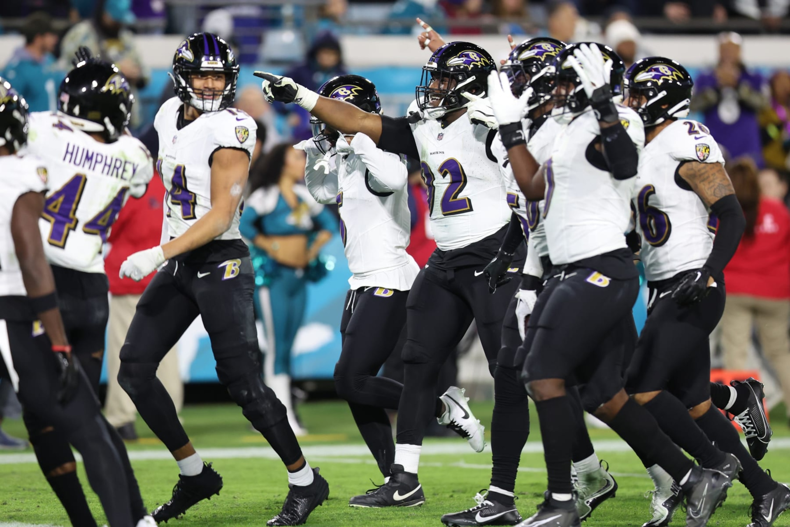 JACKSONVILLE, FLORIDA - DECEMBER 17: Justin Madubuike #92 of the Baltimore Ravens celebrates with teammates after his forced fumble against the Jacksonville Jaguars during the fourth quarter at EverBank Stadium on December 17, 2023 in Jacksonville, Florida. Madubuike tied an NFL record for 11 straight games with at least .5 sacks. (Photo by Mike Carlson/Getty Images)