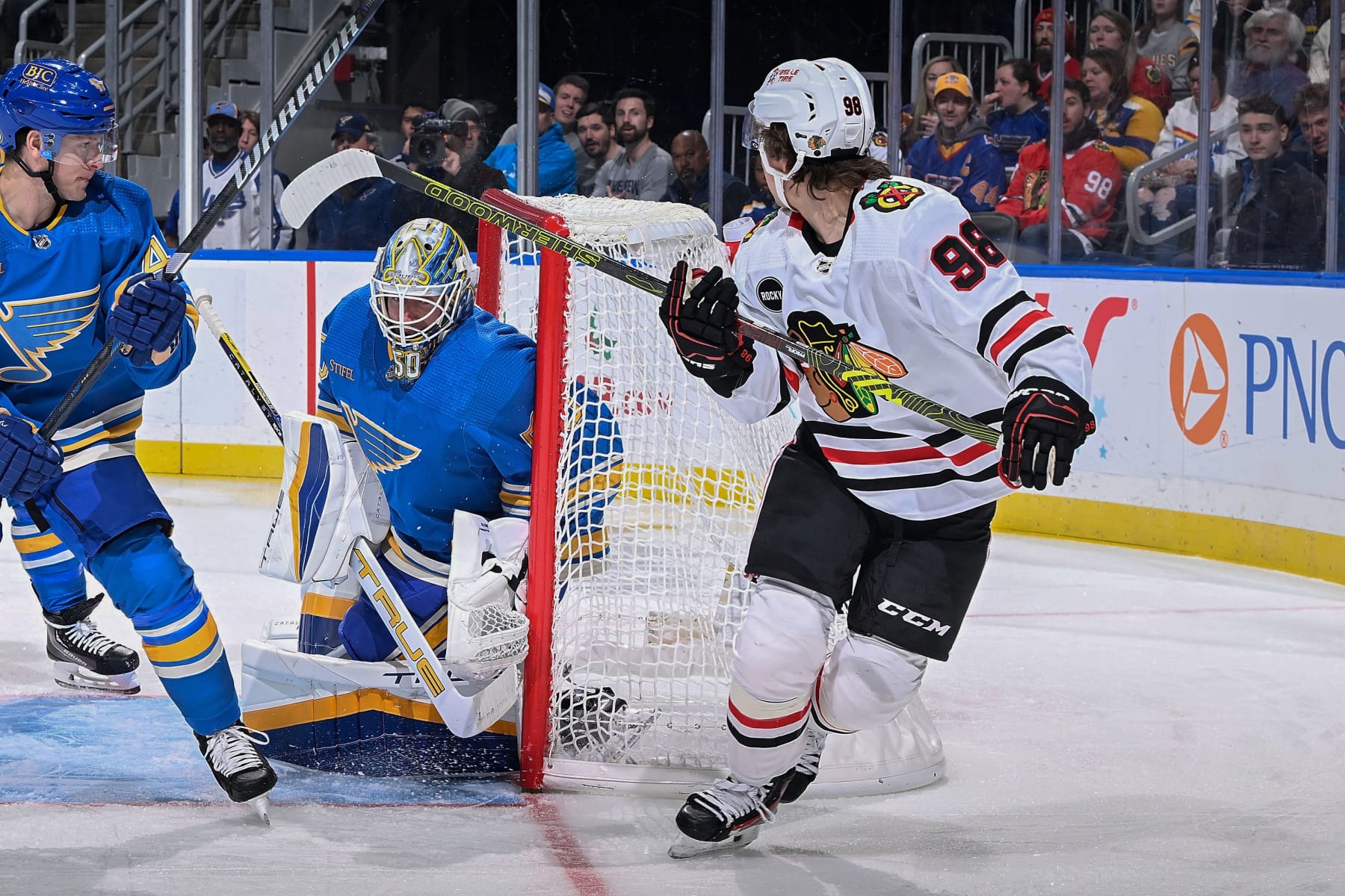 ST. LOUIS, MO - DECEMBER 23: Connor Bedard #98 of the Chicago Blackhawks scores a goal against Jordan Binnington #50 of the St. Louis Blues on December 23, 2023 at the Enterprise Center in St. Louis, Missouri. (Photo by Scott Rovak/NHLI via Getty Images)