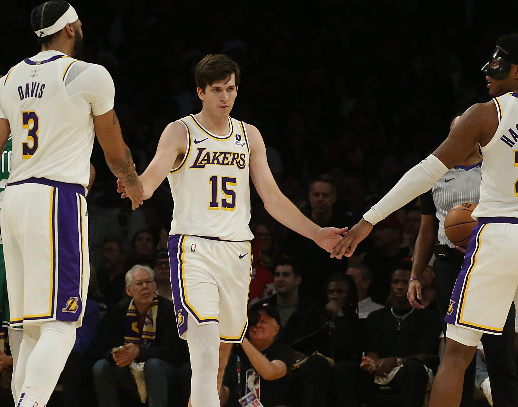 Los Angeles, CA - Lakers guard Austin Reaves is congratulated by teammates Anthony Davis, left, and Rui Hachimura after scoring a layup against the Celtics in the second quarter at Crypto.com Arena in Los Angeles on Christmas Day, Dec. 25, 2023. (Luis Sinco / Los Angeles Times via Getty Images)
