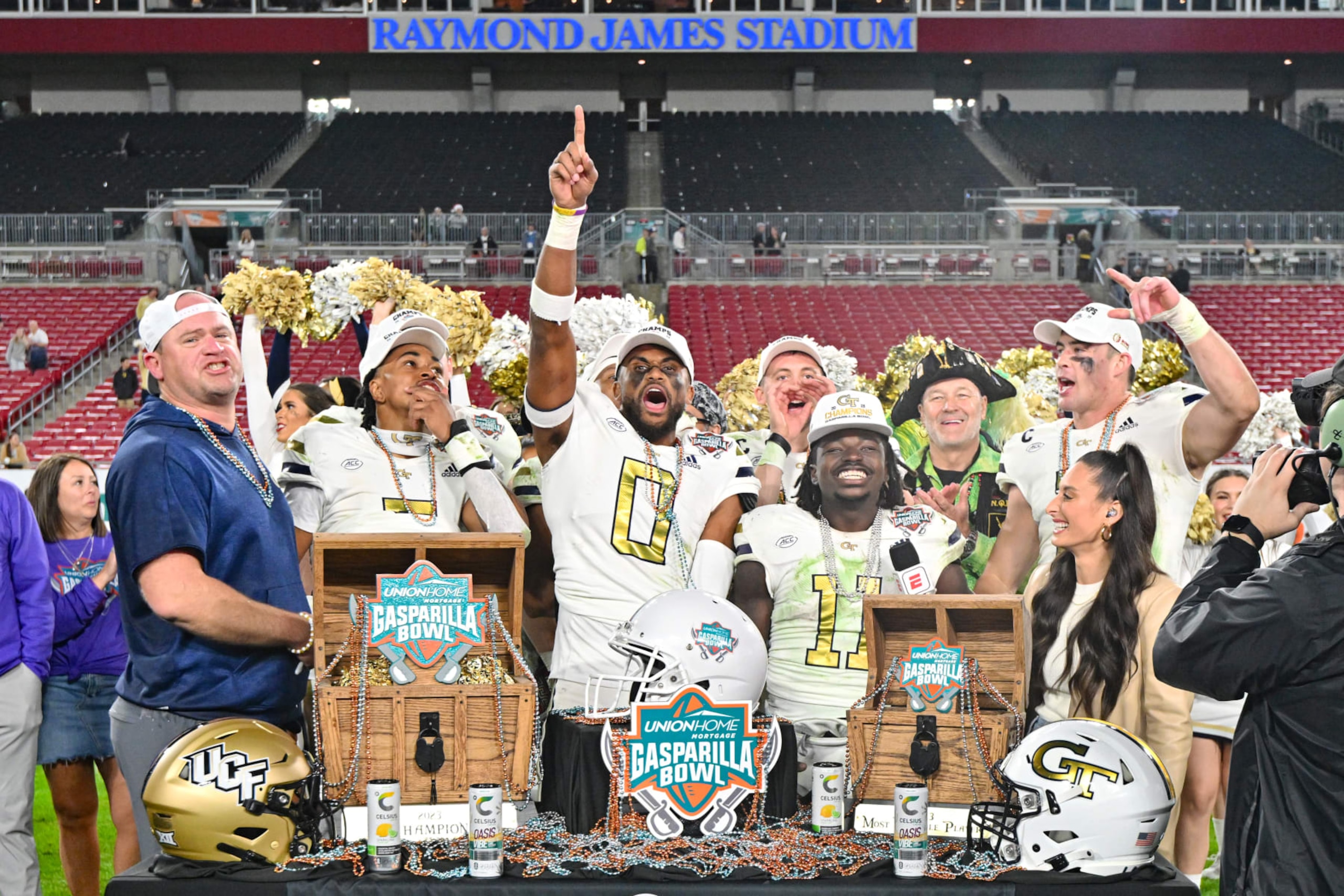 TAMPA, FLORIDA - DECEMBER 22: The Georgia Tech Yellow Jackets celebrate after defeating the UCF Knights 30-17 to win the 2023 Union Home Mortgage Gasparilla Bowl at Raymond James Stadium on December 22, 2023 in Tampa, Florida. (Photo by Julio Aguilar/Getty Images) TAMPA, FLORIDA - DECEMBER 22: The Georgia Tech Yellow Jackets celebrate after defeating the UCF Knights 30-17 to win the 2023 Union Home Mortgage Gasparilla Bowl at Raymond James Stadium on December 22, 2023 in Tampa, Florida. (Photo by Julio Aguilar/Getty Images)