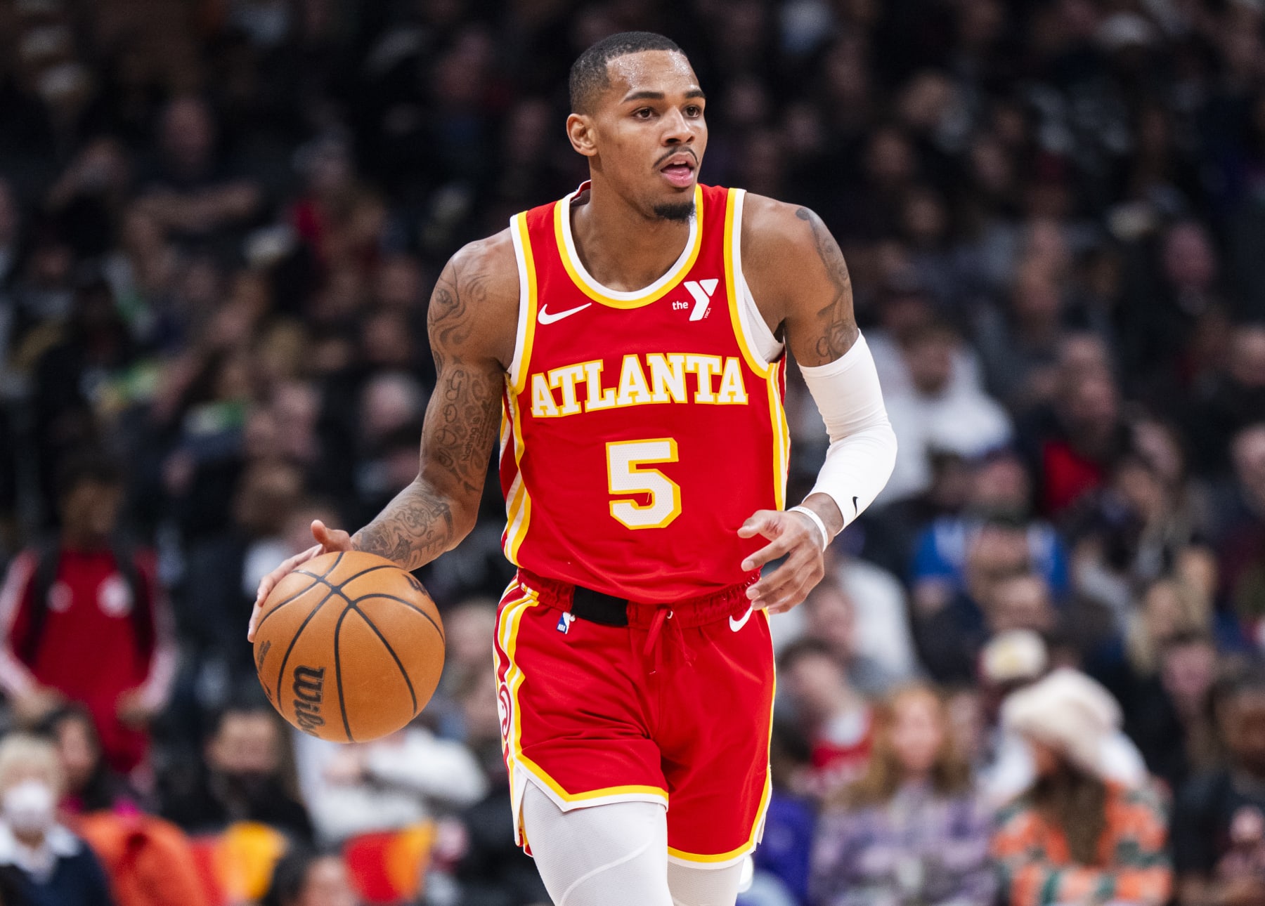 TORONTO, ON - DECEMBER 15: Dejounte Murray #5 of the Atlanta Hawks dribbles against the Toronto Raptors during the first half of their basketball game at the Scotiabank Arena on December 15, 2023 in Toronto, Ontario, Canada. NOTE TO USER: User expressly acknowledges and agrees that, by downloading and/or using this Photograph, user is consenting to the terms and conditions of the Getty Images License Agreement. (Photo by Mark Blinch/Getty Images)
