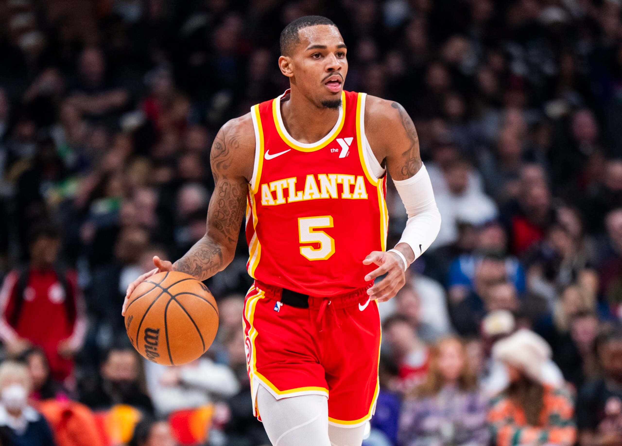 TORONTO, ON - DECEMBER 15: Dejounte Murray #5 of the Atlanta Hawks dribbles against the Toronto Raptors during the first half of their basketball game at the Scotiabank Arena on December 15, 2023 in Toronto, Ontario, Canada. NOTE TO USER: User expressly acknowledges and agrees that, by downloading and/or using this Photograph, user is consenting to the terms and conditions of the Getty Images License Agreement. (Photo by Mark Blinch/Getty Images)