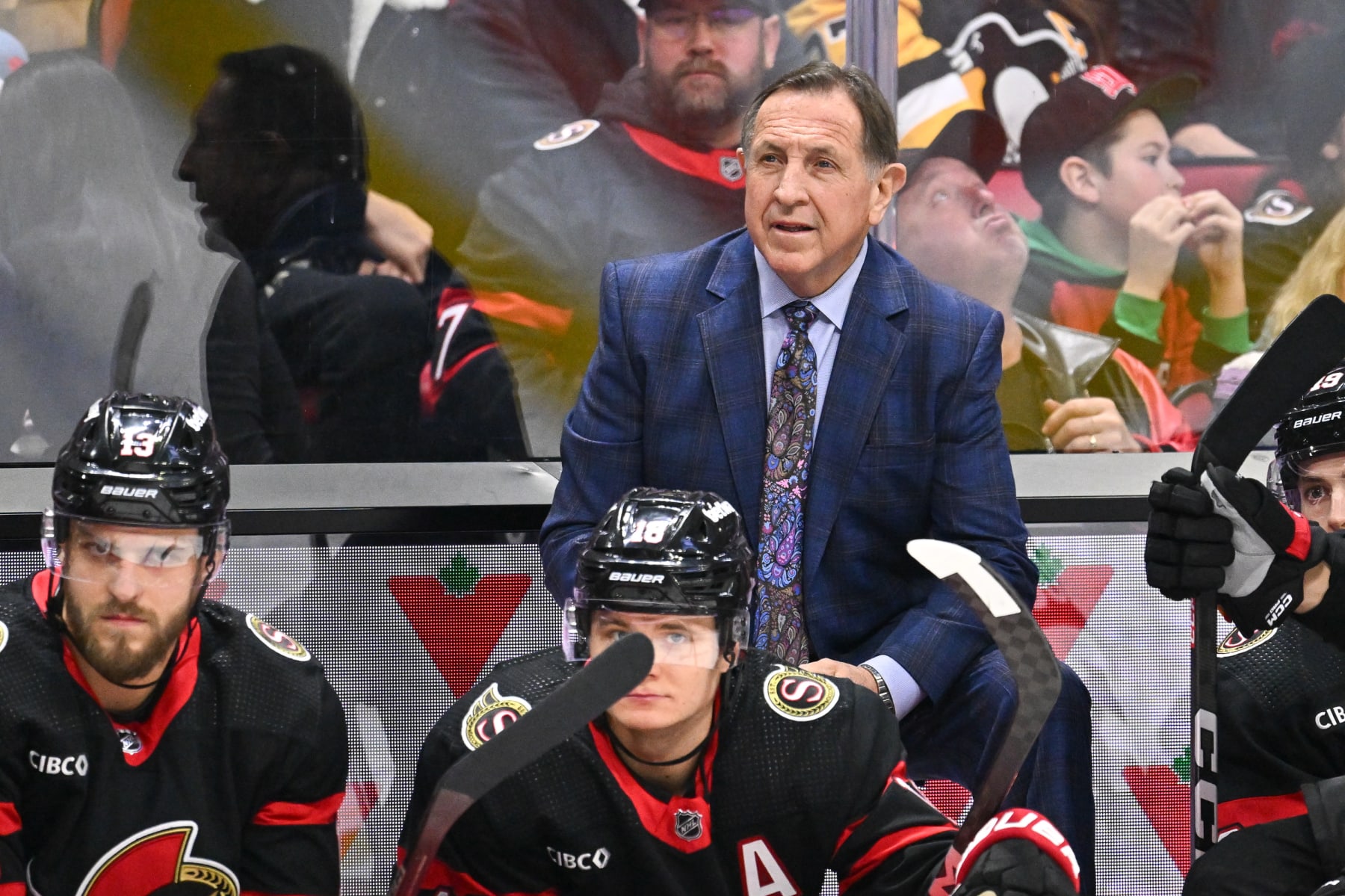 OTTAWA, CANADA - DECEMBER 23: Interim head coach Jacques Martin of the Ottawa Senators handles bench duties during the first period Pittsburgh Penguins at Canadian Tire Centre on December 23, 2023 in Ottawa, Ontario, Canada. (Photo by Minas Panagiotakis/Getty Images)