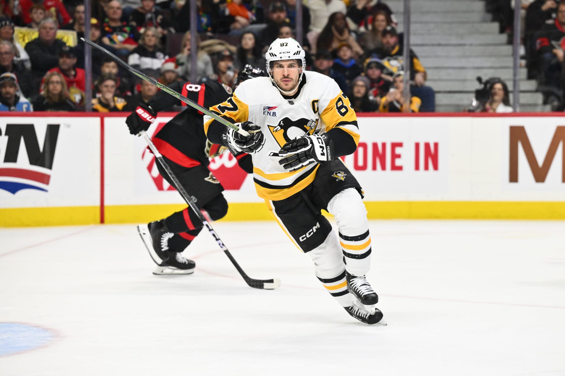 OTTAWA, CANADA - DECEMBER 23:  Sidney Crosby #87 of the Pittsburgh Penguins skates during the third period against the Ottawa Senators at Canadian Tire Centre on December 23, 2023 in Ottawa, Ontario, Canada.  The Ottawa Senators defeated the Pittsburgh Penguins 5-4 in overtime.  (Photo by Minas Panagiotakis/Getty Images)