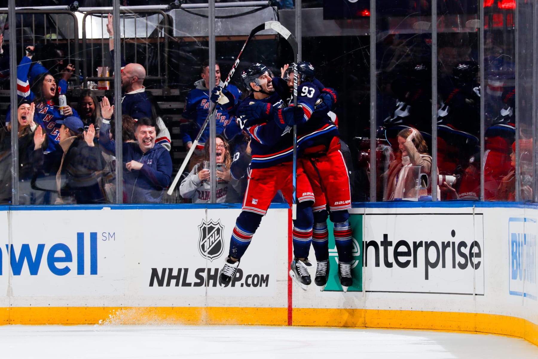 NEW YORK, NEW YORK - DECEMBER 23:  Chris Kreider #20 and Mika Zibanejad #93 of the New York Rangers celebrate after the game winning goal in overtime against the Buffalo Sabres at Madison Square Garden on December 23, 2023 in New York City. (Photo by Jared Silber/NHLI via Getty Images)
