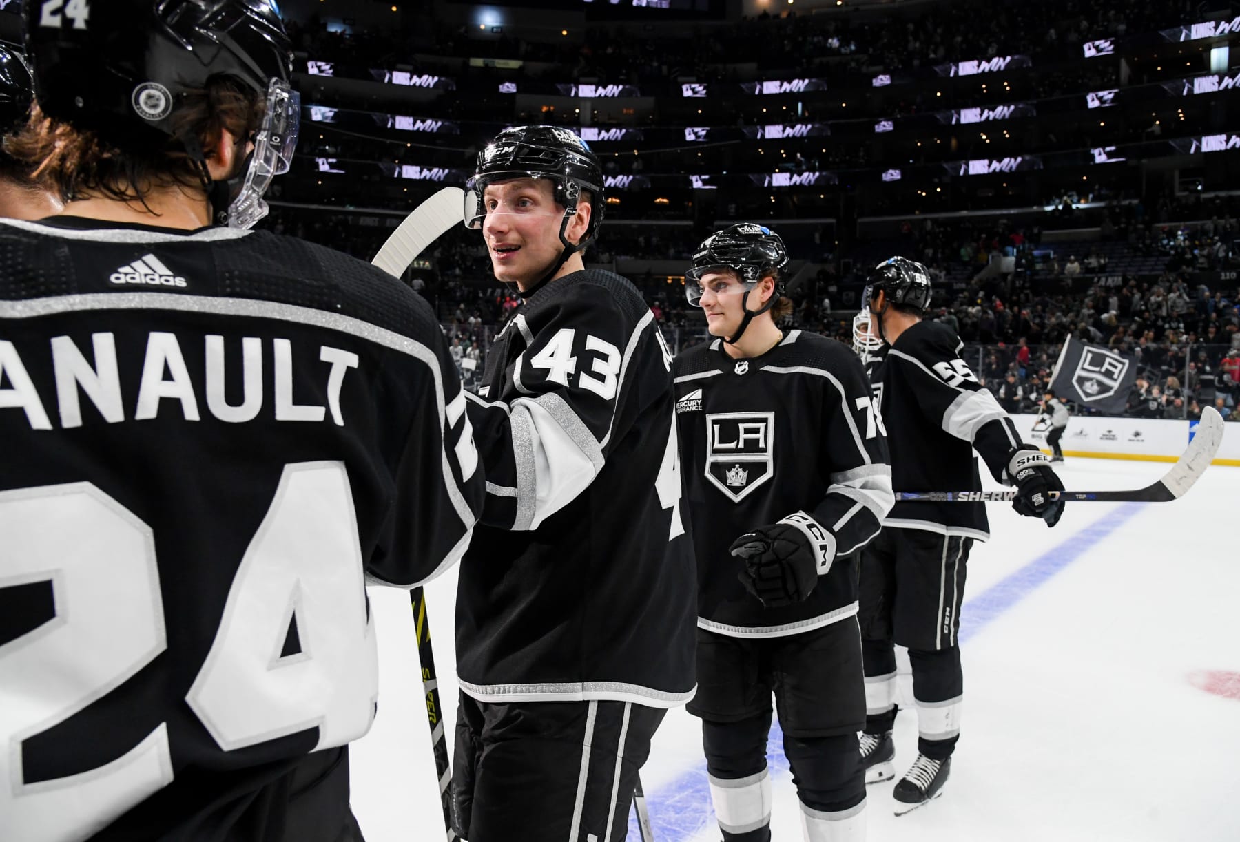 LOS ANGELES, CA - DECEMBER 23: Phillip Danault #24 of the Los Angeles Kings and Jacob Moverare #43 celebrate their victory against the Calgary Flames at Crypto.com Arena on December 23, 2023 in Los Angeles, California. (Photo by Juan Ocampo/NHLI via Getty Images)