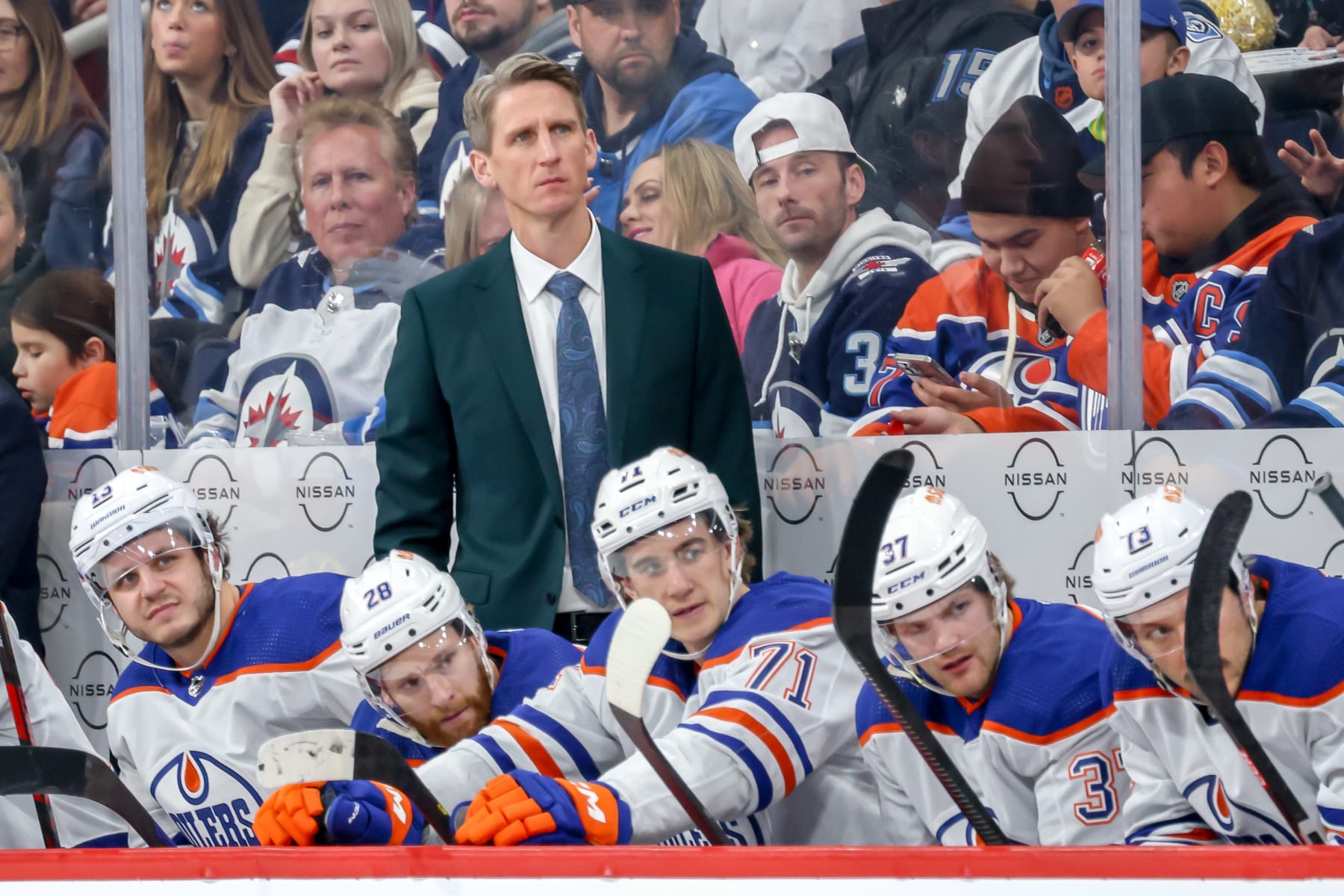 WINNIPEG, CANADA - NOVEMBER 30: Head Coach Kris Knoblauch of the Edmonton Oilers looks on from the bench during second period action against the Winnipeg Jets at the Canada Life Centre on November 30, 2023 in Winnipeg, Manitoba, Canada. (Photo by Jonathan Kozub/NHLI via Getty Images)