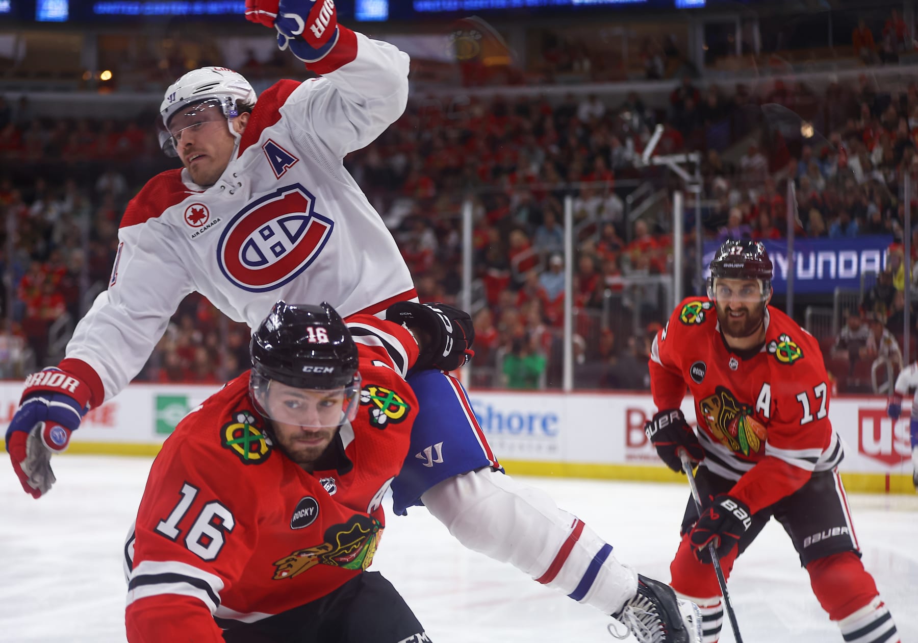 CHICAGO, IL - DECEMBER 22: Brendan Gallagher #11 of the Montreal Canadiens and Jason Dickinson #16 of the Chicago Blackhawks in action during the third period at the United Center on December 22, 2023 in Chicago, Illinois. (Photo by Melissa Tamez/Icon Sportswire via Getty Images)