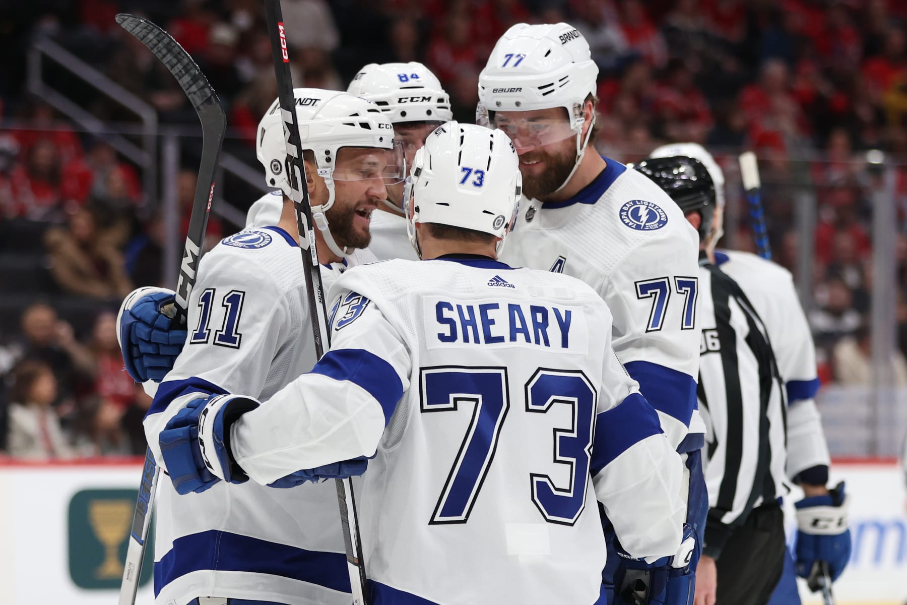WASHINGTON, DC - DECEMBER 23: Luke Glendening #11 of the Tampa Bay Lightning celebrates with teammates after scoring a goal against the Washington Capitals during the first period at Capital One Arena on December 23, 2023 in Washington, DC. (Photo by Patrick Smith/Getty Images)