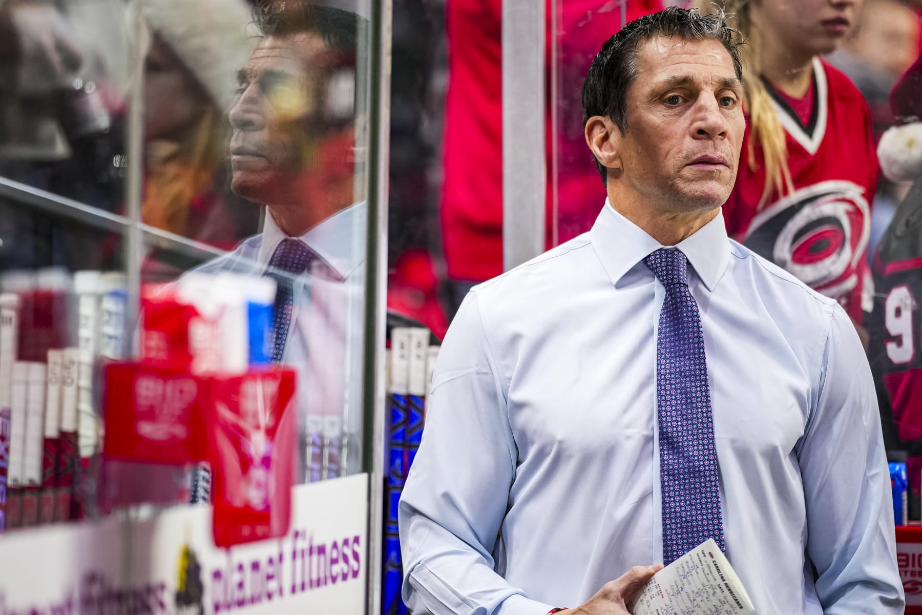 RALEIGH, NORTH CAROLINA - DECEMBER 15: Rod Brind'Amour of the Carolina Hurricanes looks on during warmups prior to an NHL hockey game between the Nashville Predators and the Carolina Hurricanes at PNC Arena on December 15, 2023 in Raleigh, North Carolina. (Photo by (Josh Lavallee/NHLI via Getty Images)