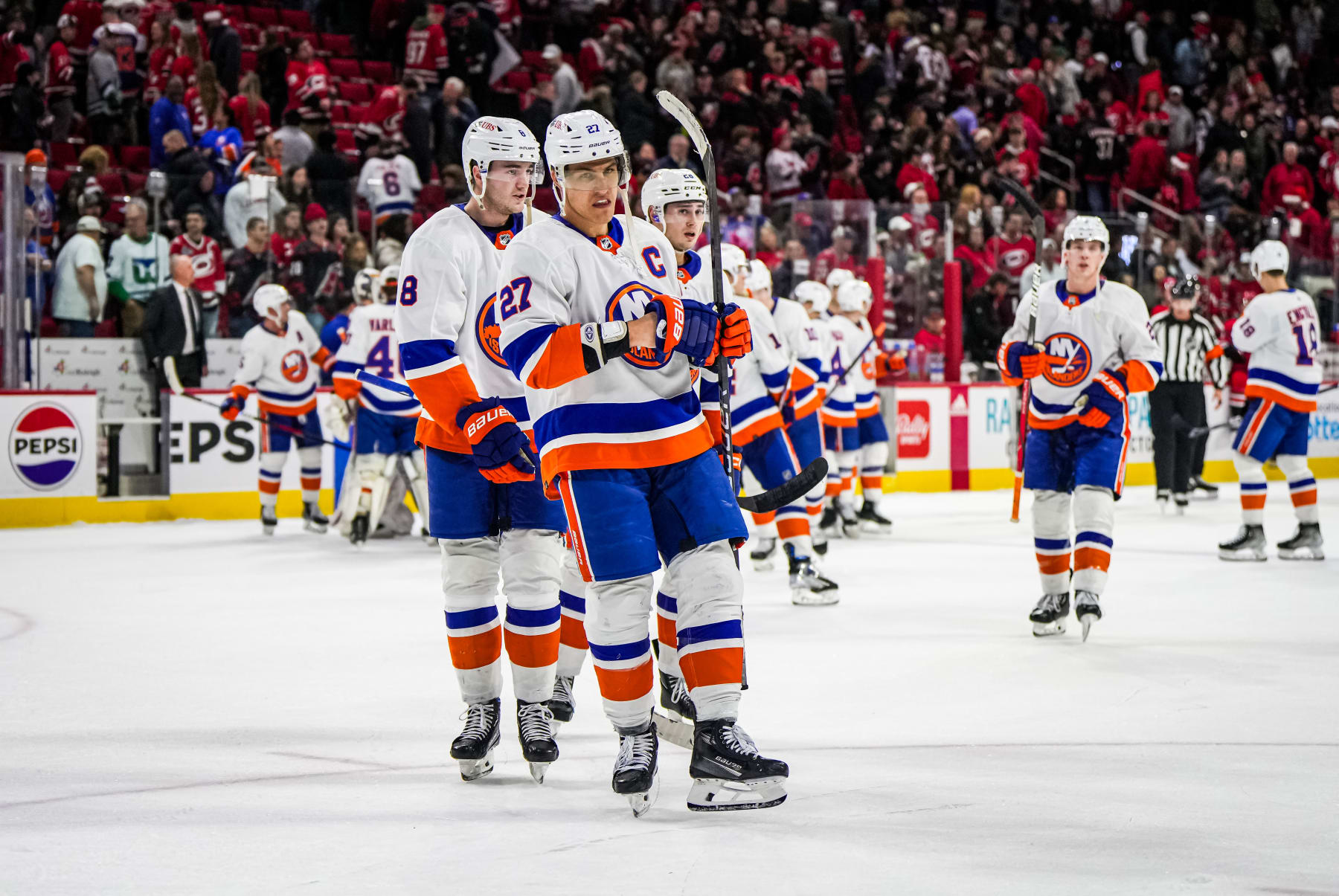 RALEIGH, NORTH CAROLINA - DECEMBER 23: Anders Lee #27 of the New York Islanders reacts after a 5-4 victory against the Carolina Hurricanes at PNC Arena on December 23, 2023 in Raleigh, North Carolina. (Photo by Cato Cataldo/NHLI via Getty Images)