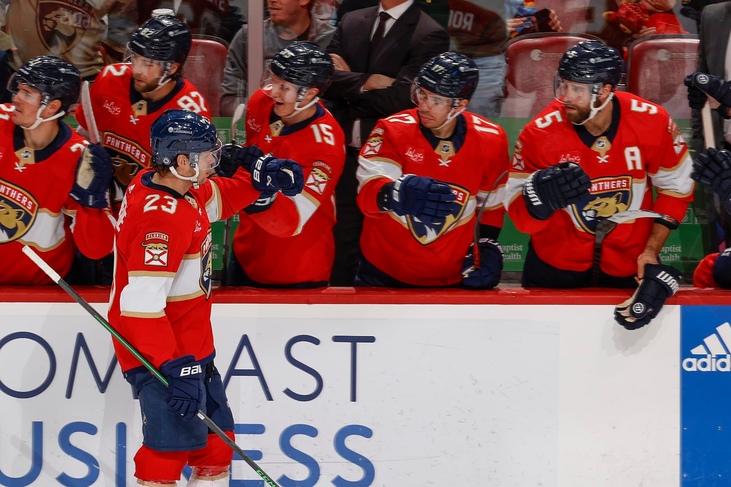 SUNRISE, FL - DECEMBER 23: Carter Verhaeghe #23 of the Florida Panthers celebrates with teammates on the bench after he scored a goal in the third period against the Vegas Golden Knights at the Amerant Bank Arena on December 23, 2023 in Sunrise, Florida. (Photo by Joel Auerbach/Getty Images)