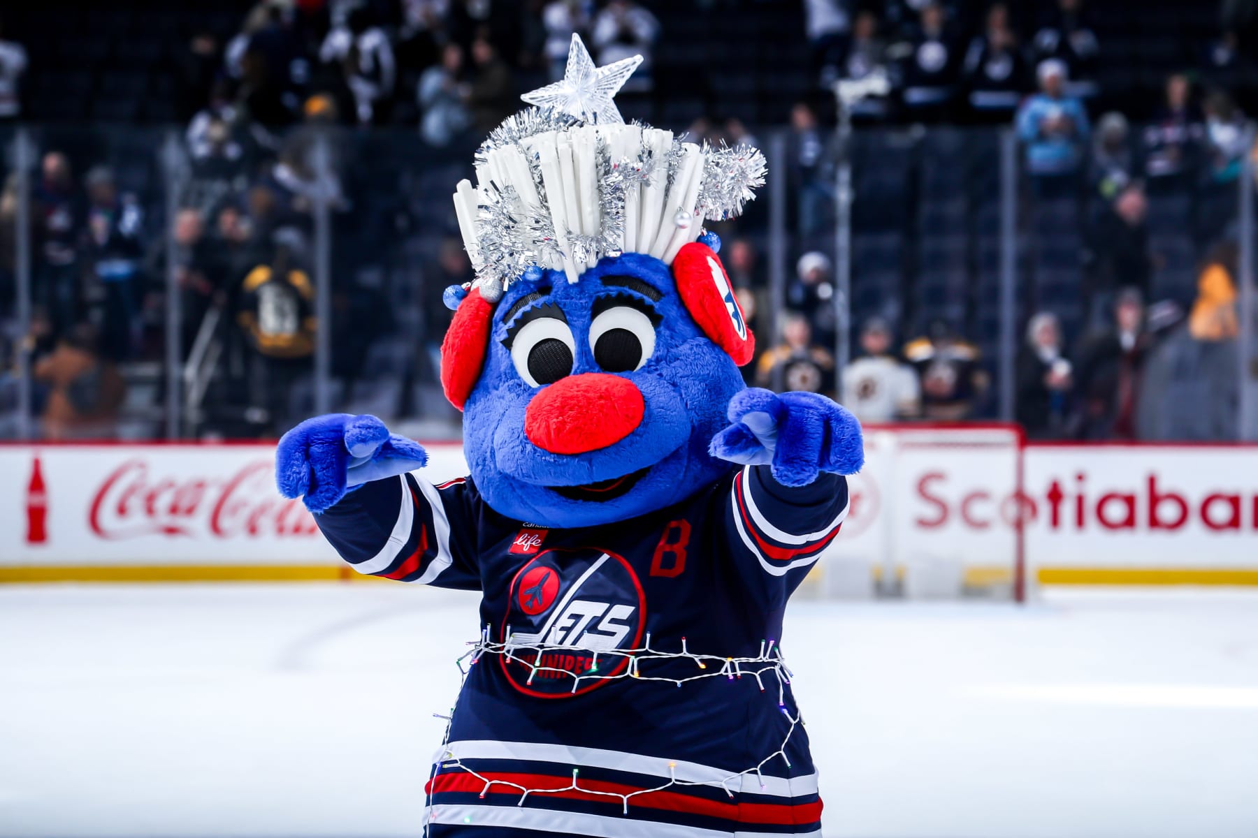 WINNIPEG, CANADA - DECEMBER 22: Winnipeg Jets Heritage mascot Benny celebrates on the ice following a 5-1 victory over the Boston Bruins at the Canada Life Centre on December 22, 2023 in Winnipeg, Manitoba, Canada. (Photo by Darcy Finley/NHLI via Getty Images)
