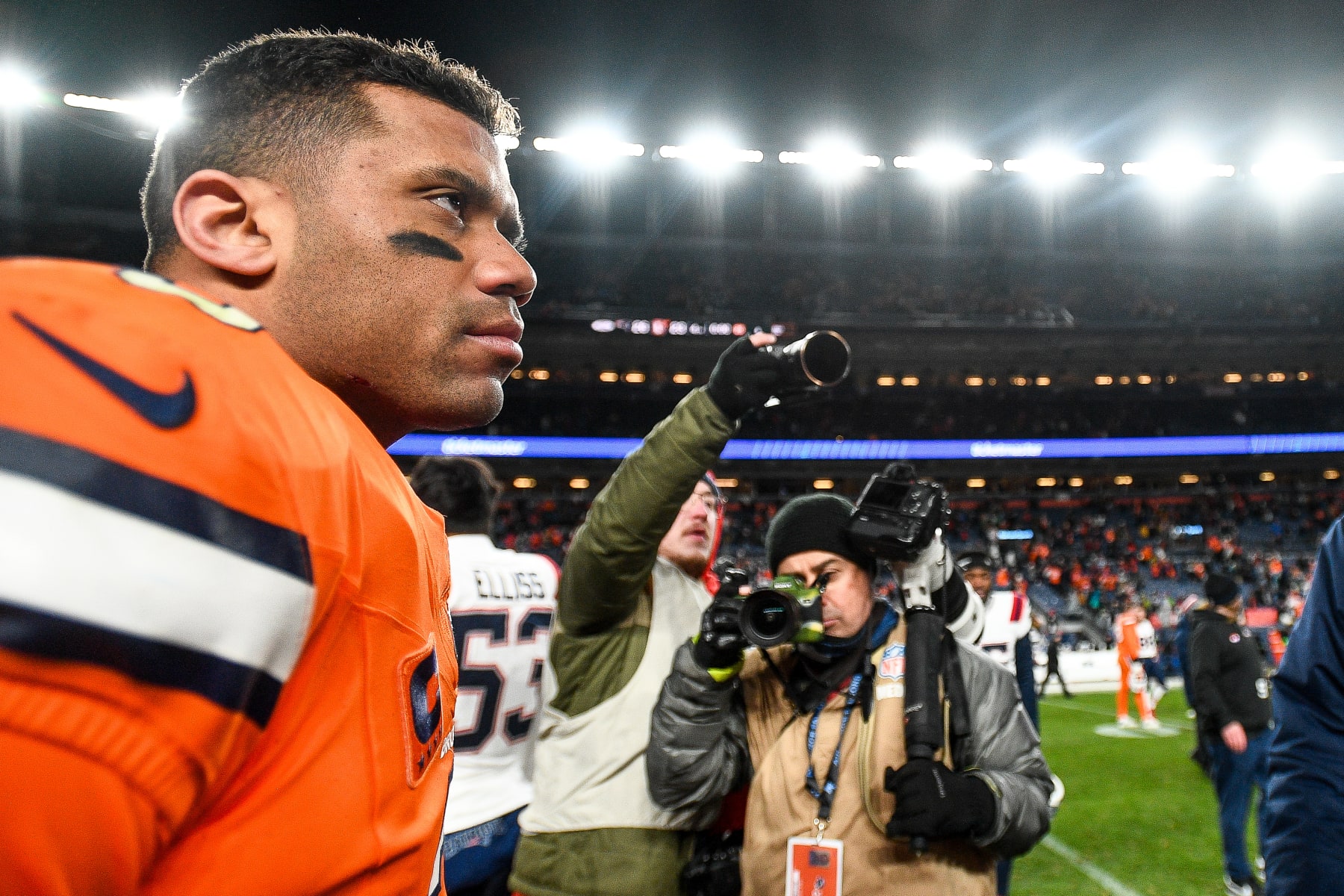 DENVER, COLORADO - DECEMBER 24:  Russell Wilson #3 of the Denver Broncos walks on the field after a game against the New England Patriots at Empower Field at Mile High on December 24, 2023 in Denver, Colorado. (Photo by Dustin Bradford/Getty Images)
