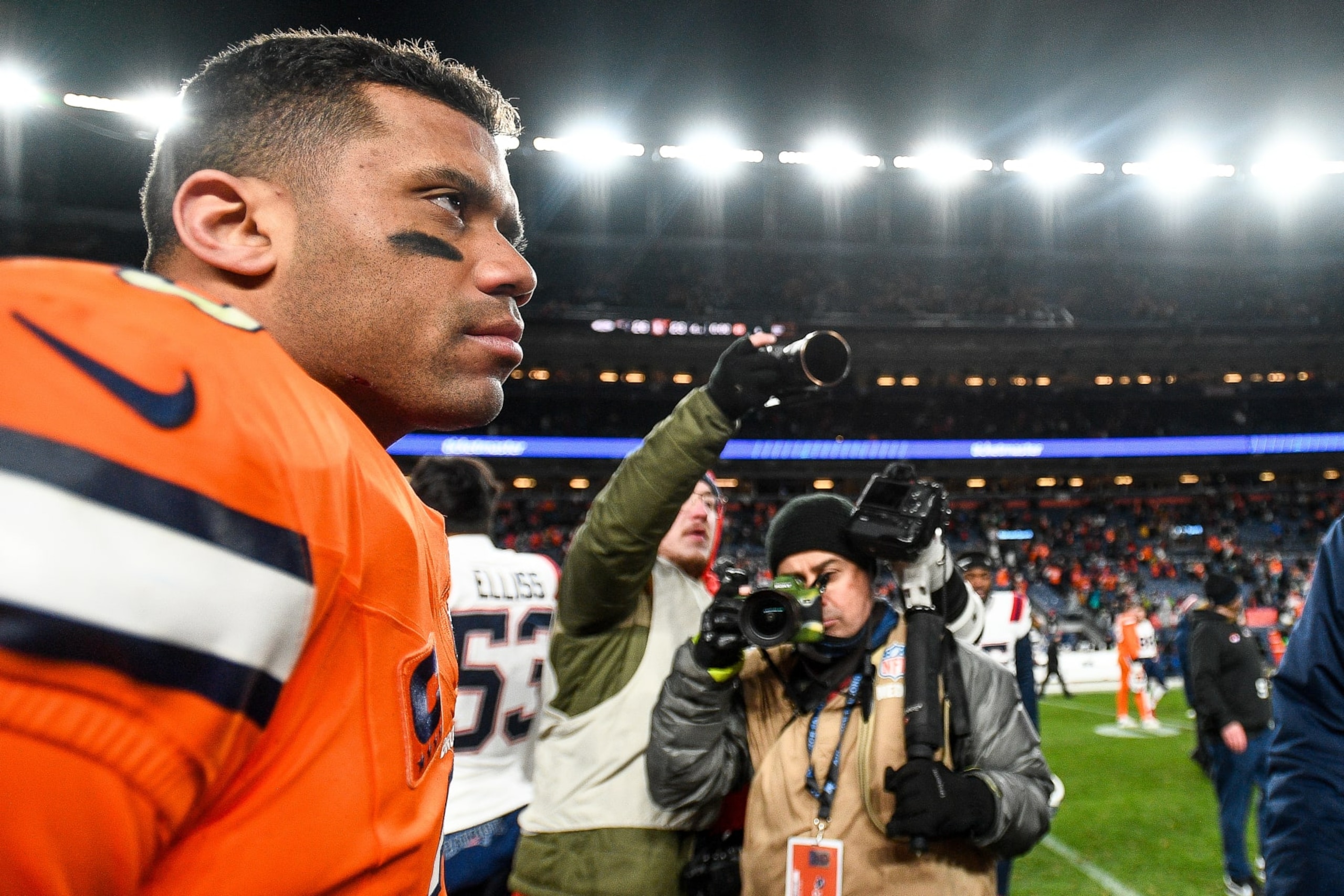 DENVER, COLORADO - DECEMBER 24:  Russell Wilson #3 of the Denver Broncos walks on the field after a game against the New England Patriots at Empower Field at Mile High on December 24, 2023 in Denver, Colorado. (Photo by Dustin Bradford/Getty Images)