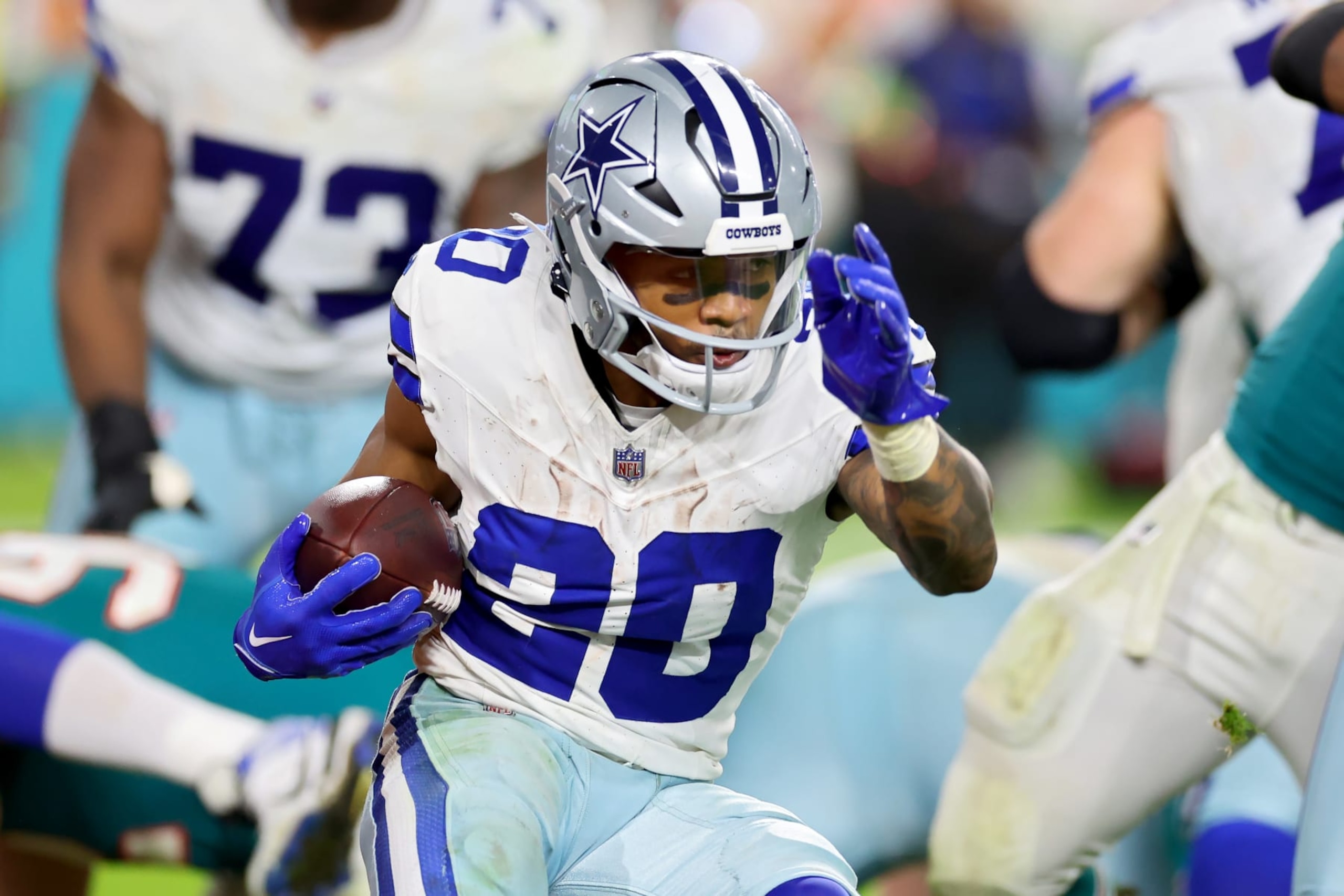 MIAMI GARDENS, FLORIDA - DECEMBER 24: Tony Pollard #20 of the Dallas Cowboys runs the ball during the third quarter in the game against the Miami Dolphins at Hard Rock Stadium on December 24, 2023 in Miami Gardens, Florida. (Photo by Stacy Revere/Getty Images)