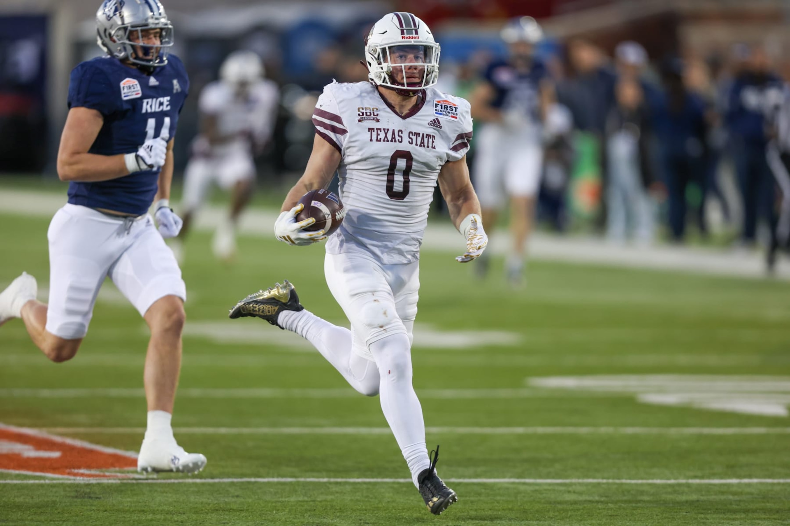 DALLAS, TX - DECEMBER 26: Texas State Bobcats linebacker Brian Holloway (0) returns an interception for a touchdown during the SERVPRO First Responder Bowl between the Texas State Bobcats and Rice Owls on December 26, 2023 at Gerald J. Ford Stadium in Dallas, TX. (Photo by George Walker/Icon Sportswire via Getty Images) DALLAS, TX - DECEMBER 26: Texas State Bobcats linebacker Brian Holloway (0) returns an interception for a touchdown during the SERVPRO First Responder Bowl between the Texas State Bobcats and Rice Owls on December 26, 2023 at Gerald J. Ford Stadium in Dallas, TX. (Photo by George Walker/Icon Sportswire via Getty Images)