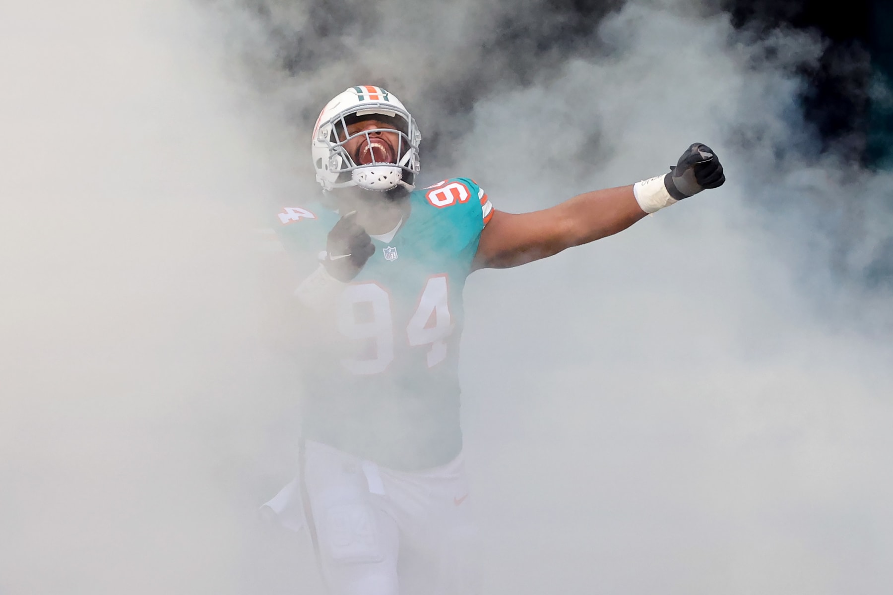 MIAMI GARDENS, FLORIDA - DECEMBER 24: Christian Wilkins #94 of the Miami Dolphins takes the field during player introductions prior to the game against the Dallas Cowboys at Hard Rock Stadium on December 24, 2023 in Miami Gardens, Florida. (Photo by Stacy Revere/Getty Images)