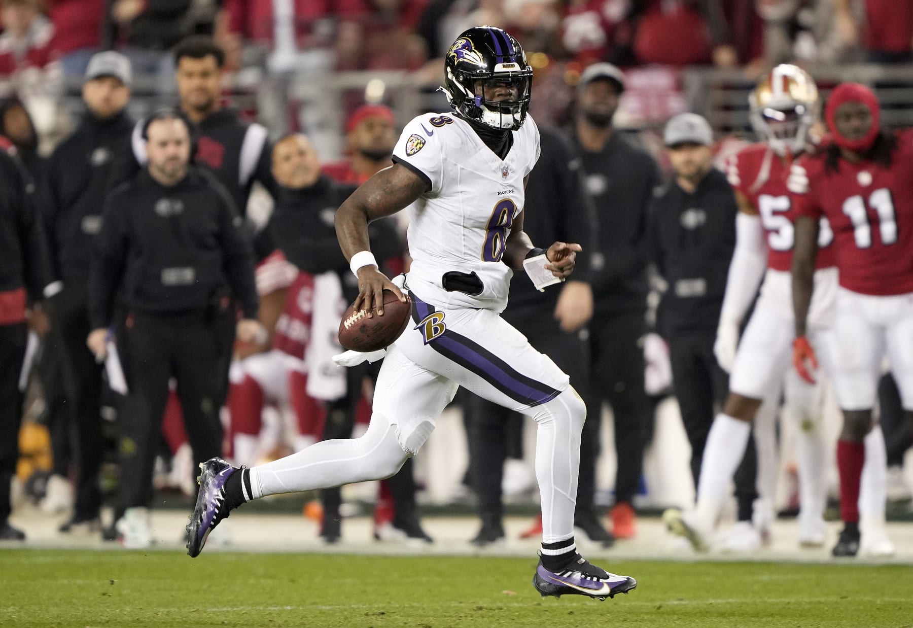 SANTA CLARA, CALIFORNIA - DECEMBER 25: Lamar Jackson #8 of the Baltimore Ravens scrambles with the ball against the San Francisco 49ers during the second quarter of an NFL football game at Levi's Stadium on December 25, 2023 in Santa Clara, California. (Photo by Thearon W. Henderson/Getty Images)
