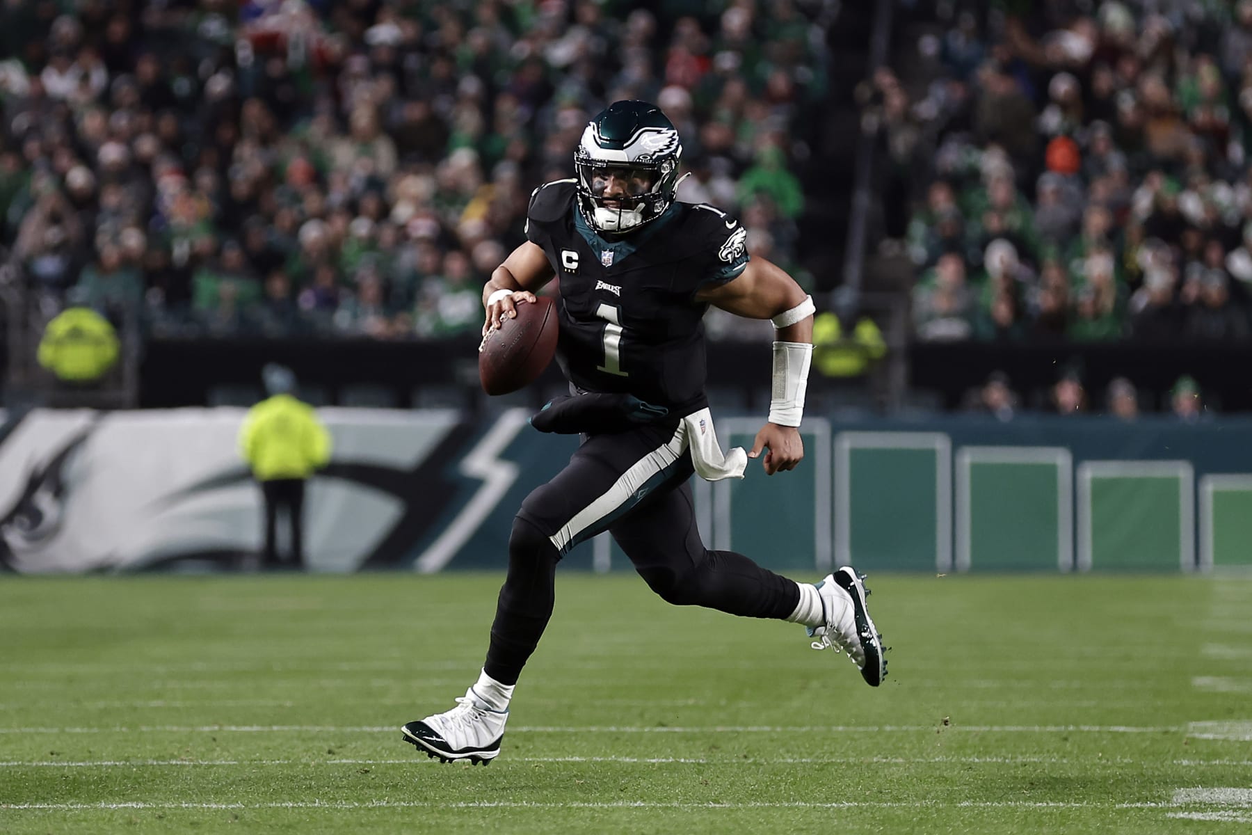 PHILADELPHIA, PENNSYLVANIA - DECEMBER 25: Jalen Hurts #1 of the Philadelphia Eagles runs the ball during the second quarter against the New York Giants at Lincoln Financial Field on December 25, 2023 in Philadelphia, Pennsylvania. (Photo by Adam Hunger/Getty Images)